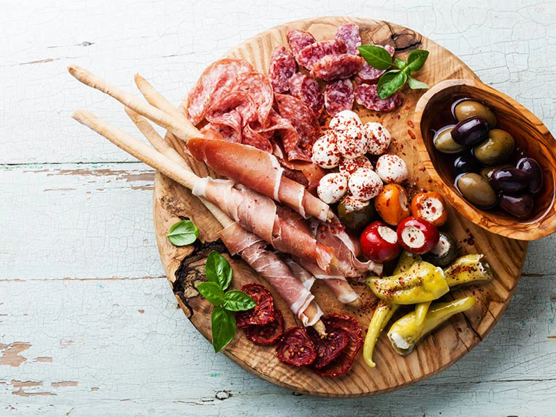 Charcuterie platter with cold meats, cheese and olives
