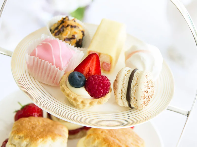 High tea tiered platter of cakes and scones