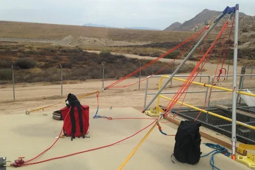 Rescue team rigging ropes for confined space standby rescue