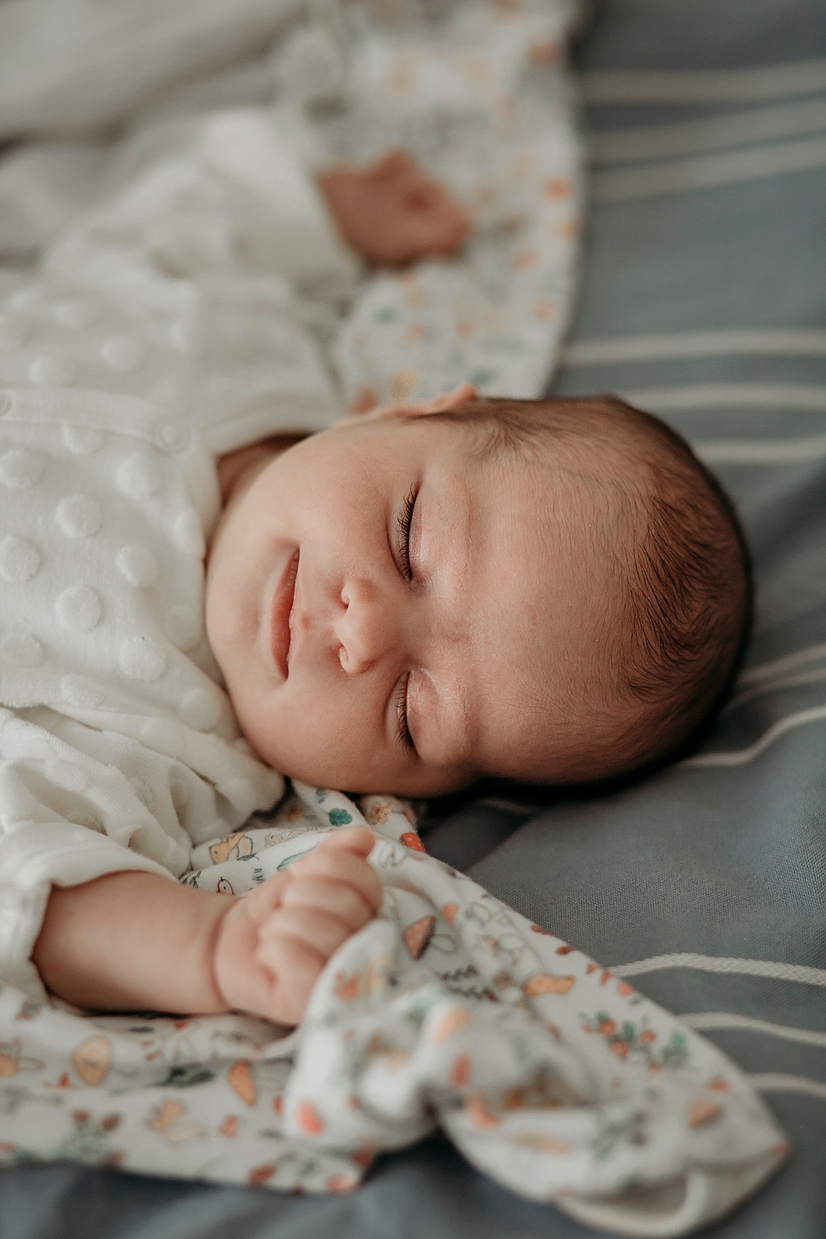 newborn smiling in her sleep