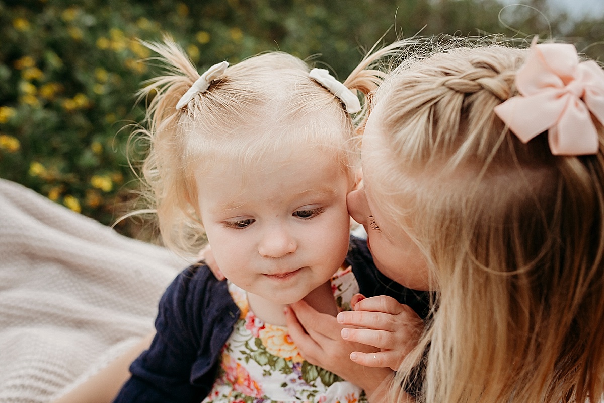 Little girls telling secrets