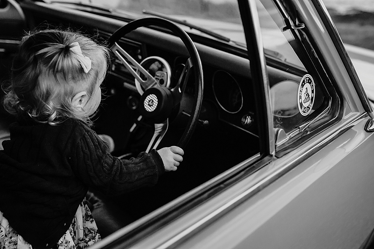 baby girl playing with steering wheel