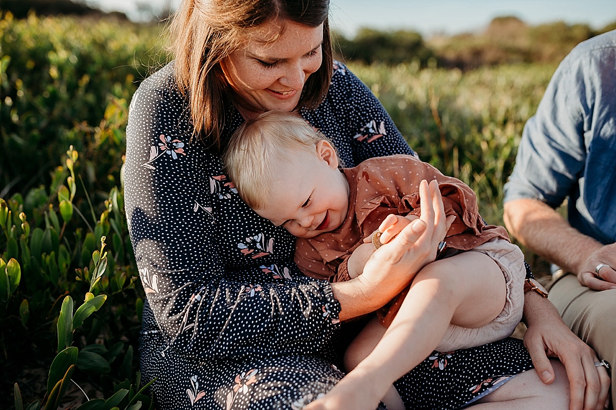 daughter been tickled by man while holding her