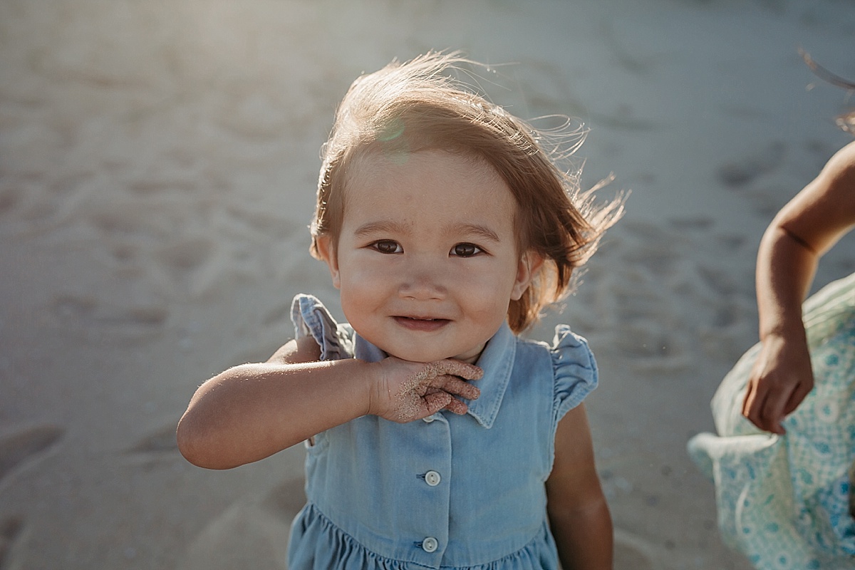 Little girl on beach at family photography session