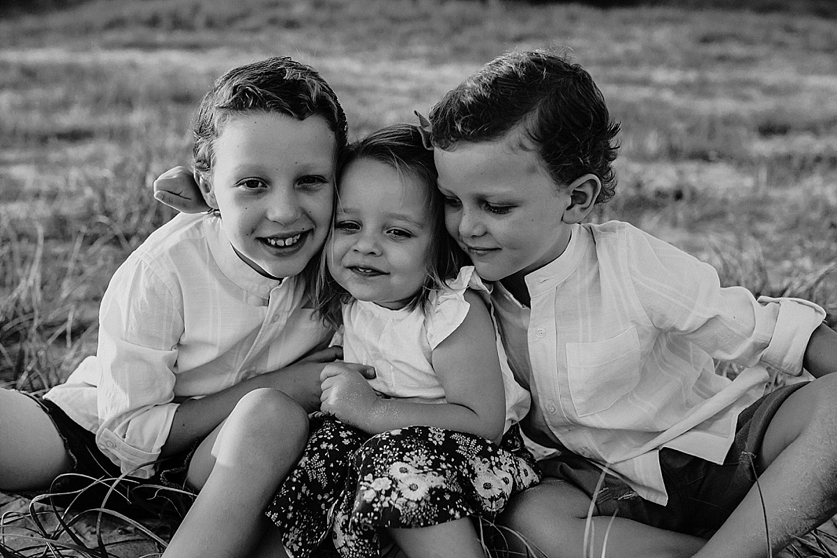 Siblings giving each other a cuddle