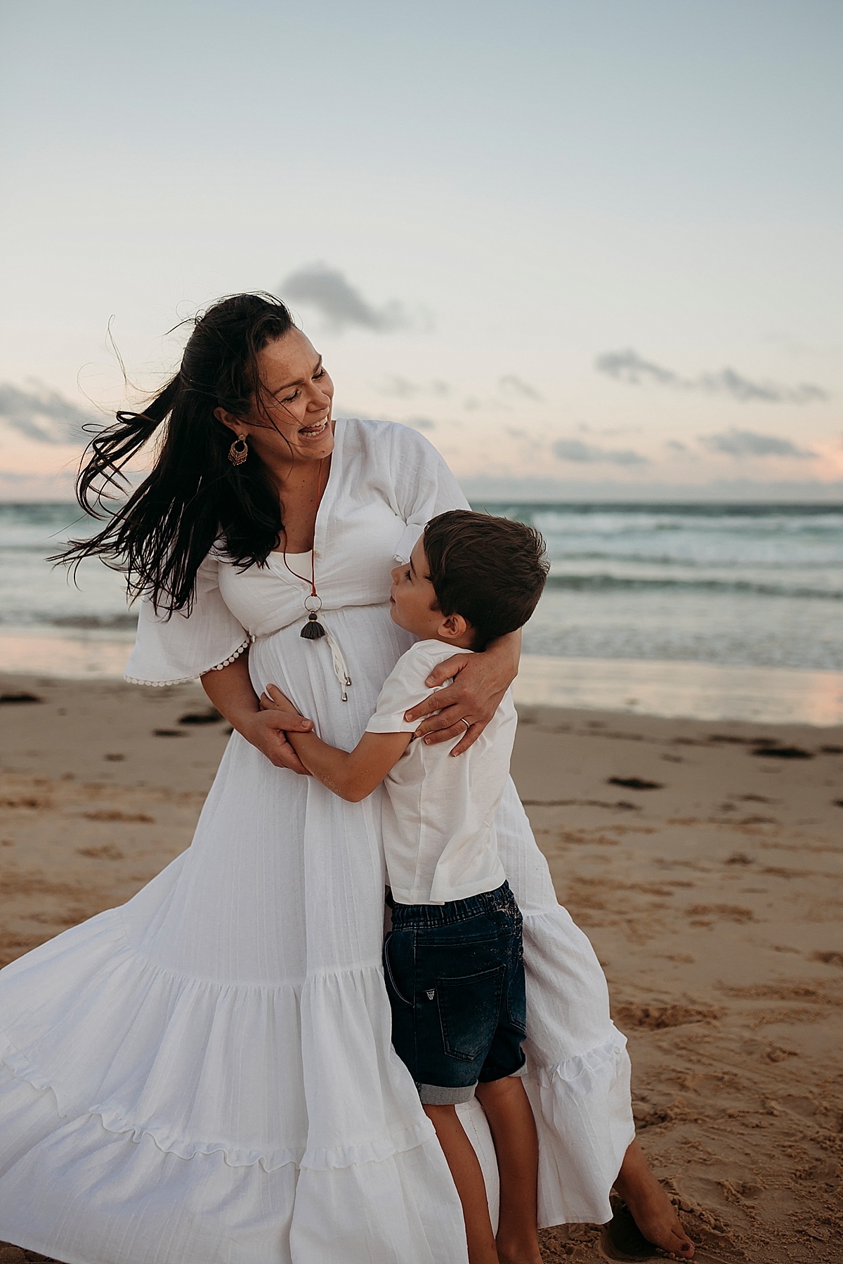 mother and son having fun on beach