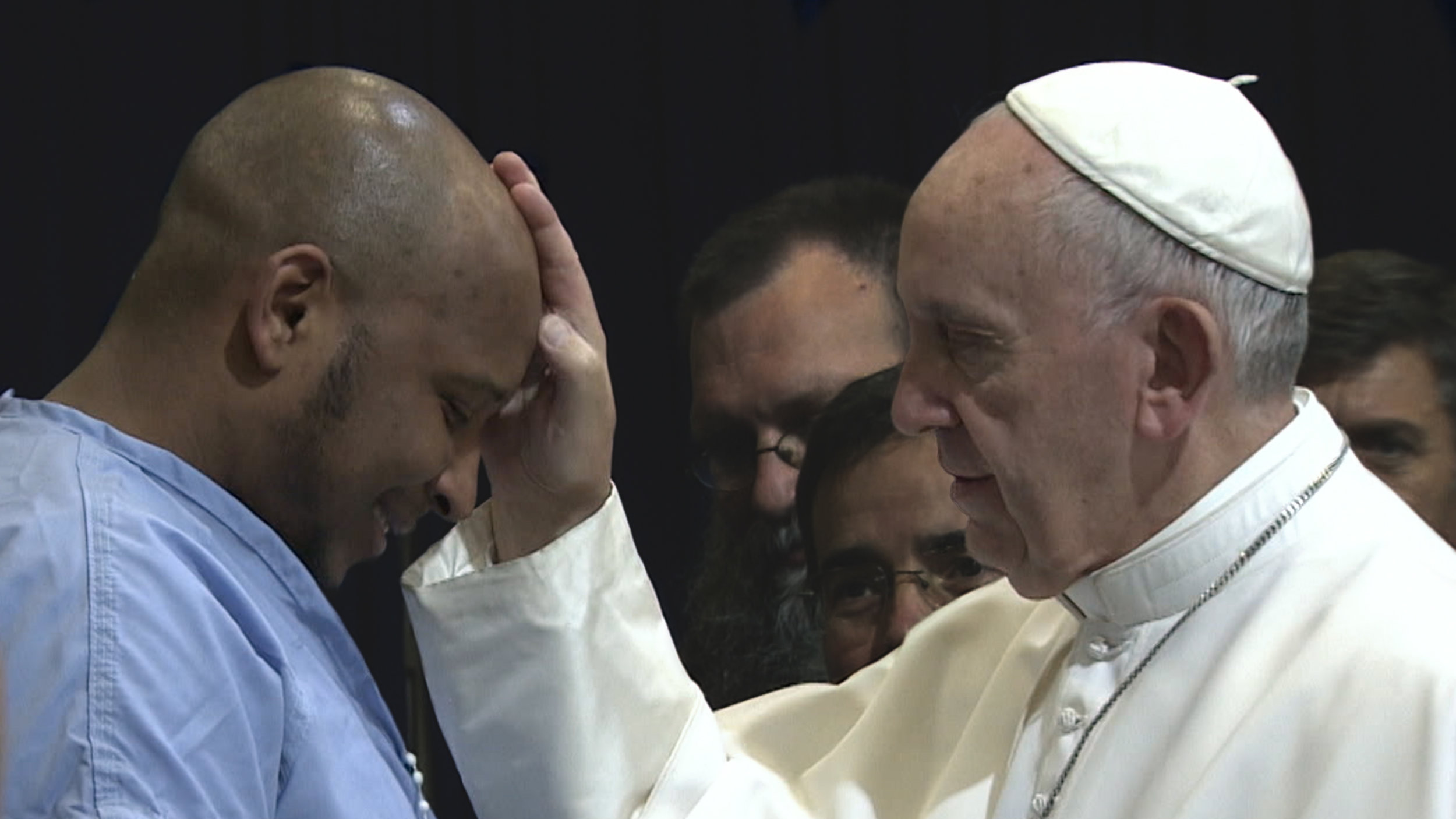 Pope Francis blesses an inmate in a Philadelphia prison.