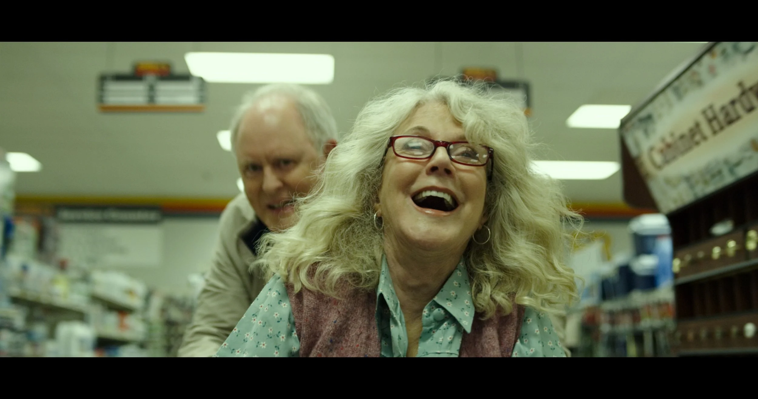 Survivalists just wanna have fun: Ed and Ronnie cut loose in a supermarket.