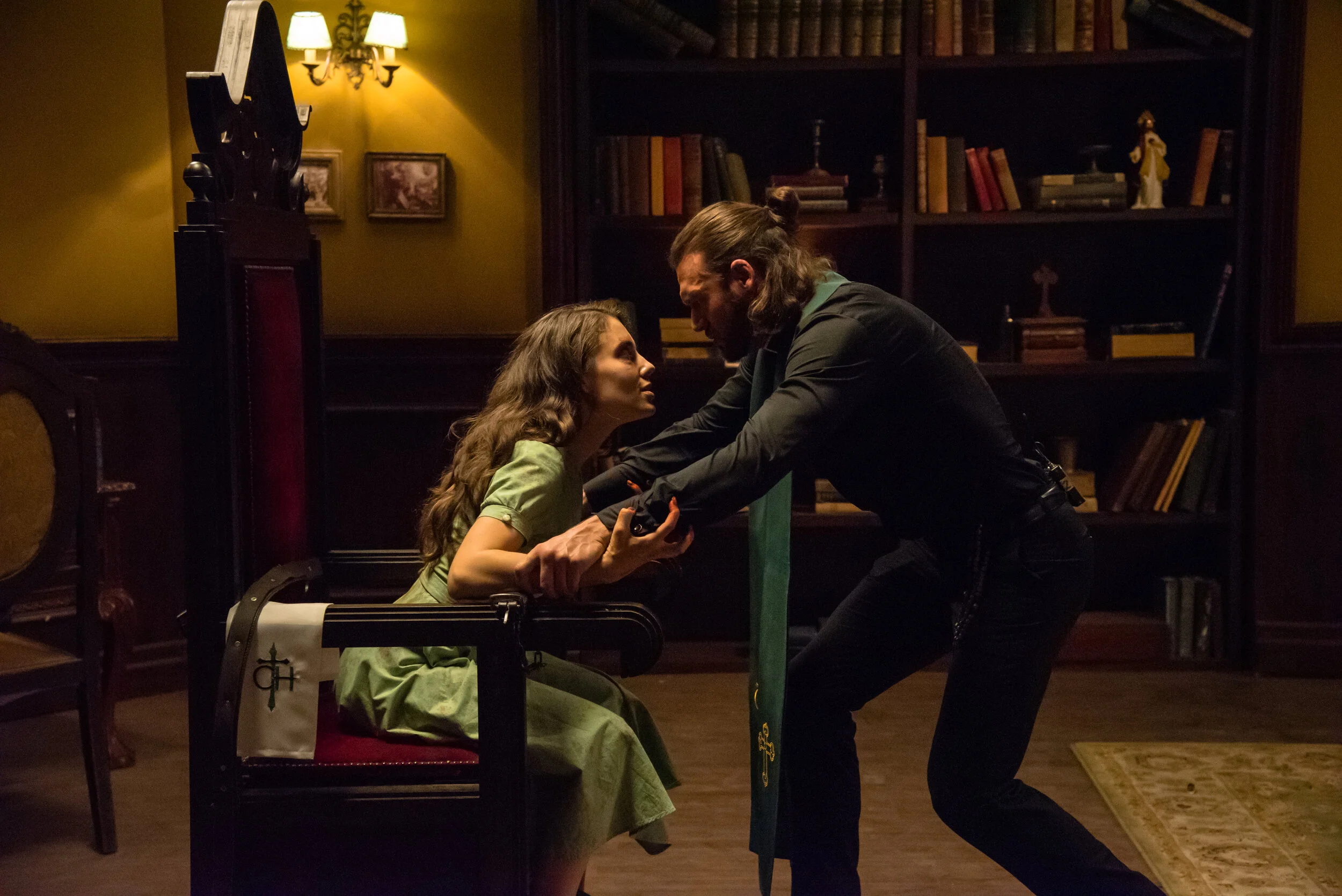 Father Max (Ryan Guzman) realizes that Lane (Alix Angelis) is going off script as her possession turns real.