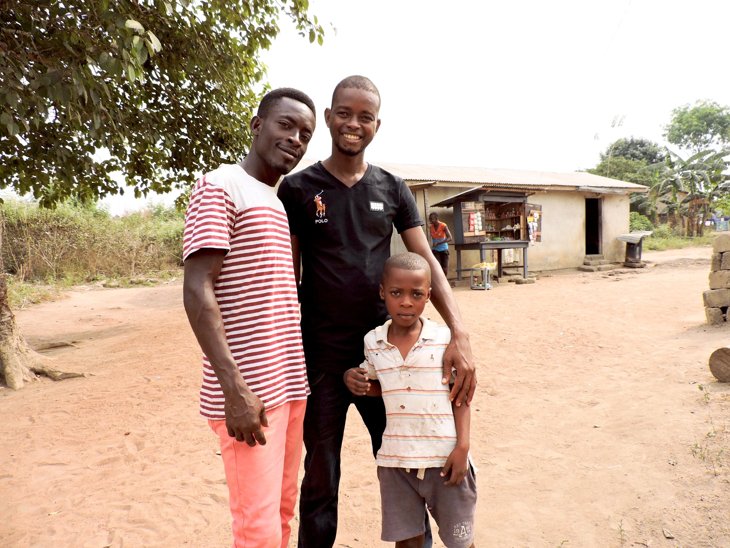 Stephen (in the middle), his brother, and a little boy on the way to the orphanage