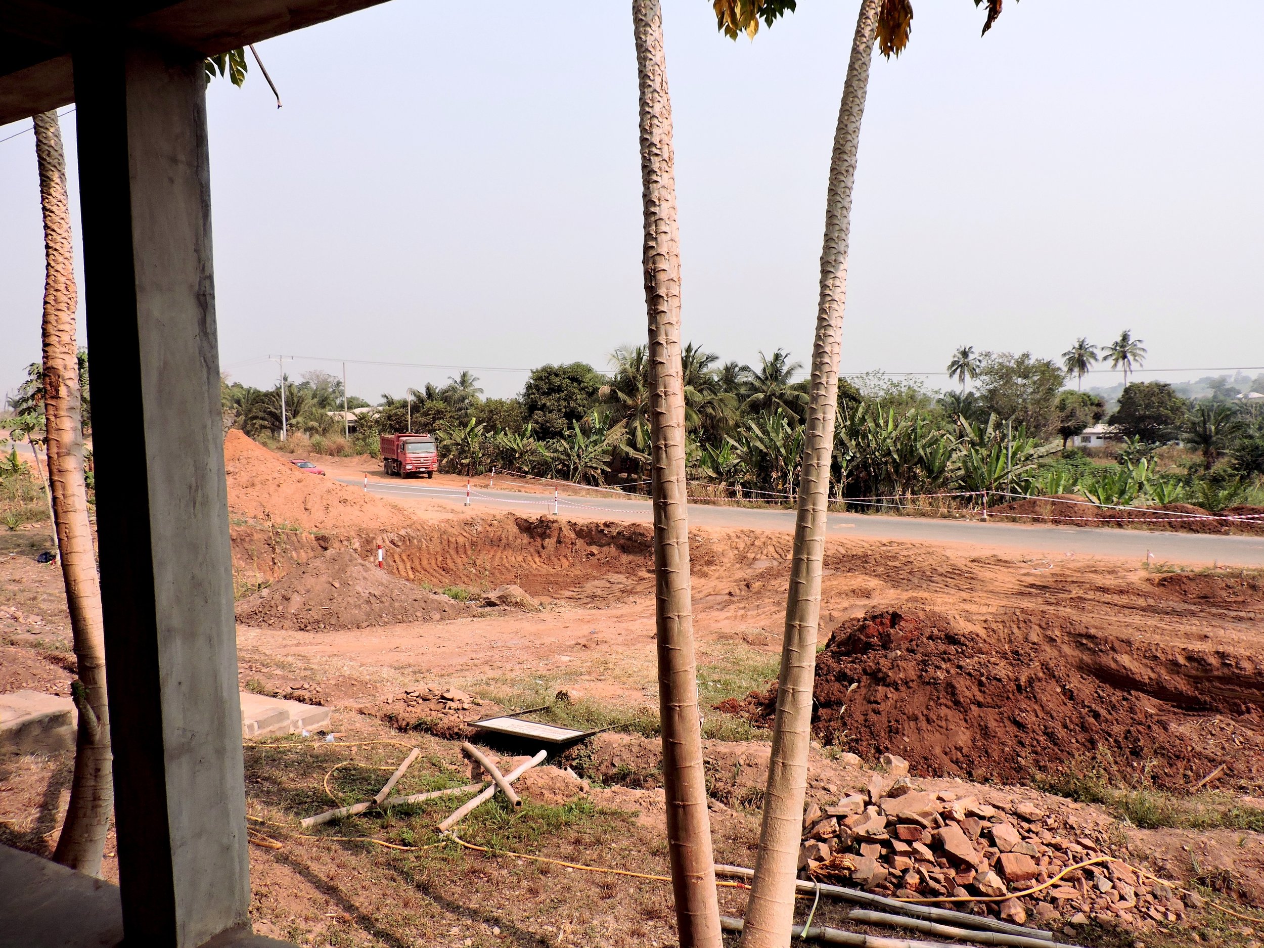 A view of the two holes dug for the road expansion in front of the VEG compound