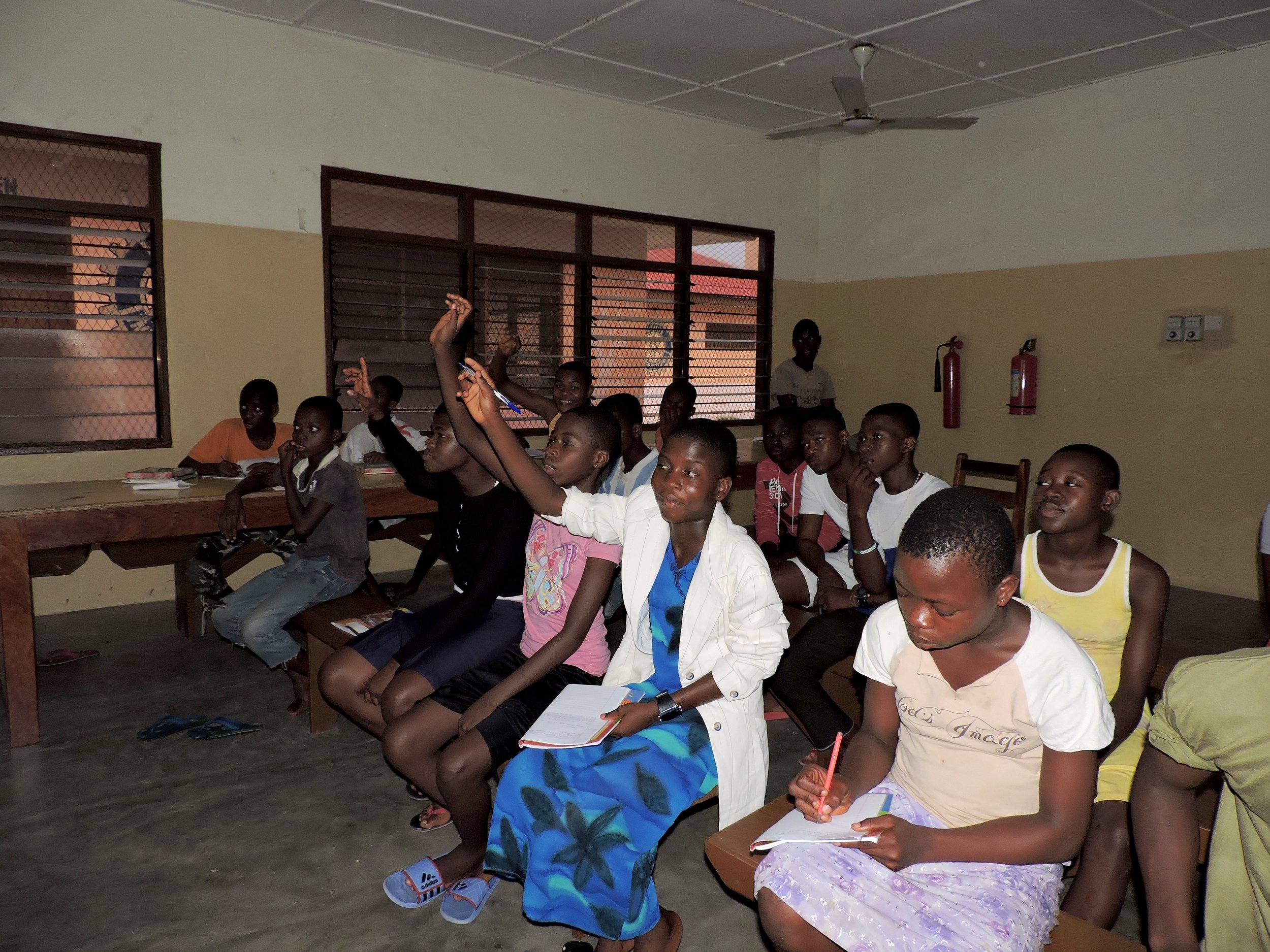 Students at MadamFo Ghana eagerly answering questions about culture