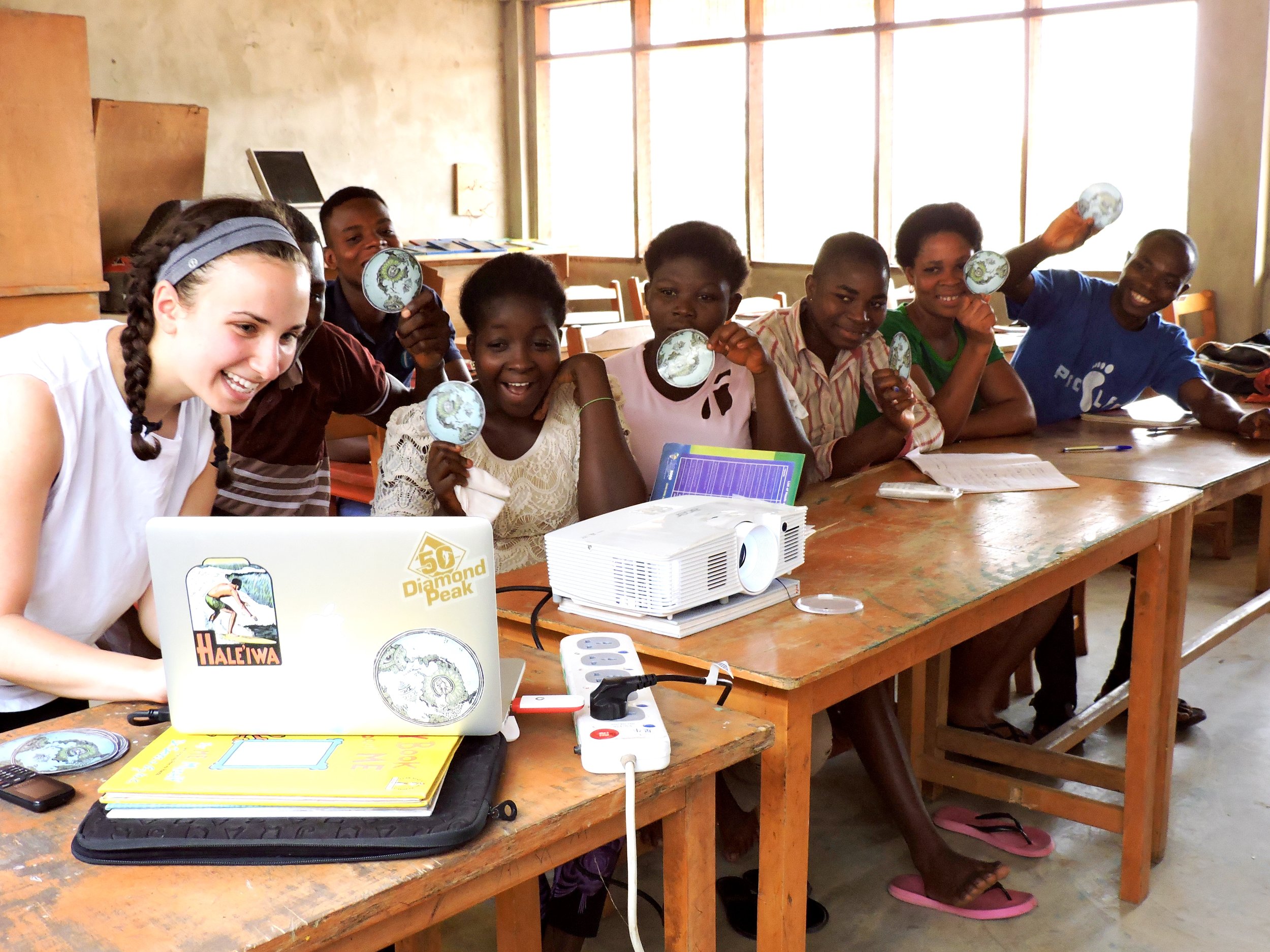 Trying to get everyone in the computer screen-showing our R.O.C. stickers here in Ghana as SB students show theirs in VT