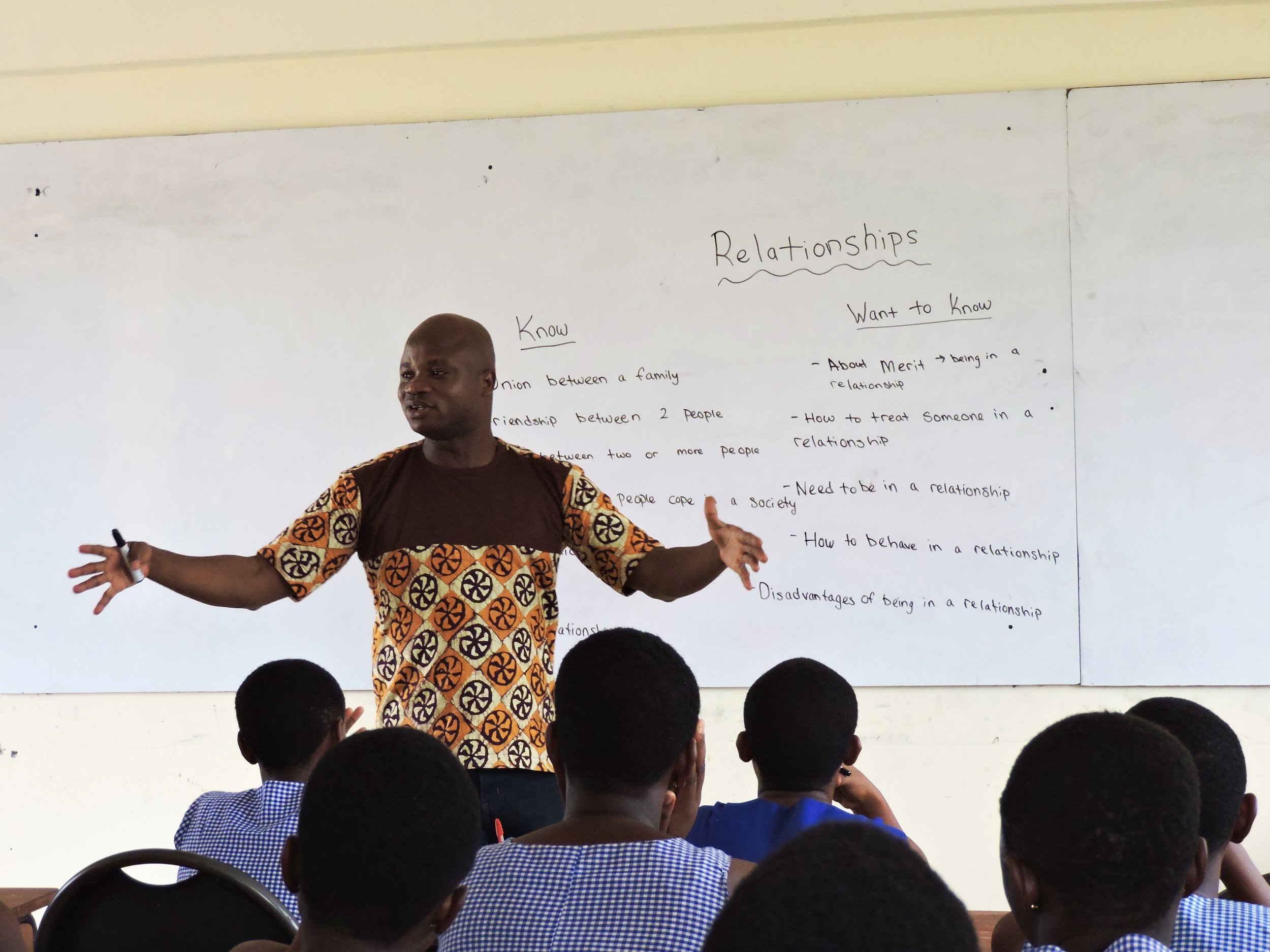 Kofi leading the class in a group discussion