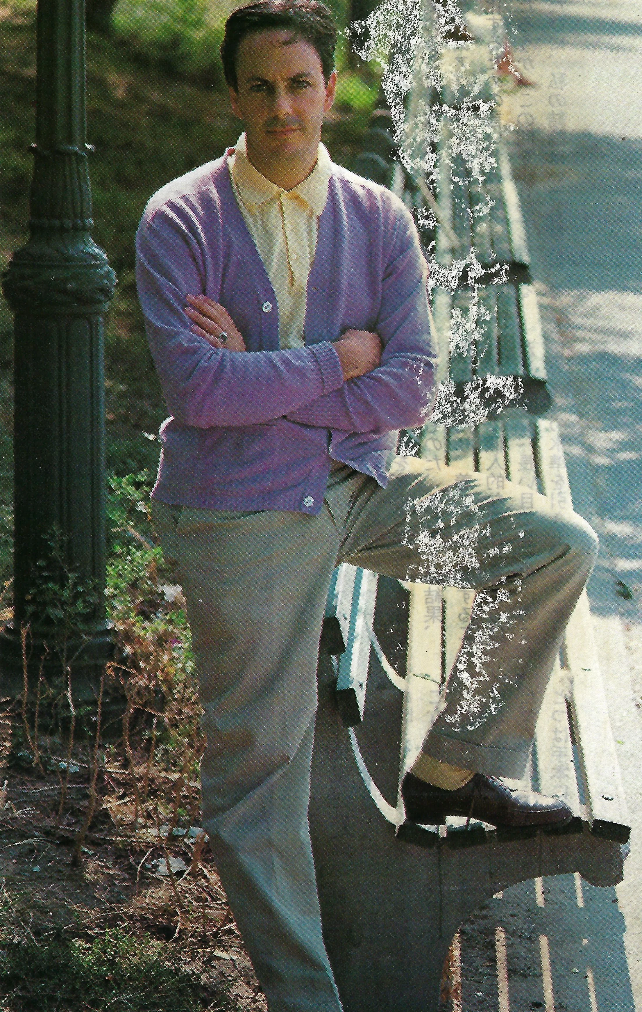 Astairity: A lavender cashmere cardigan over a yellow polo and grey tropical wool trousers .