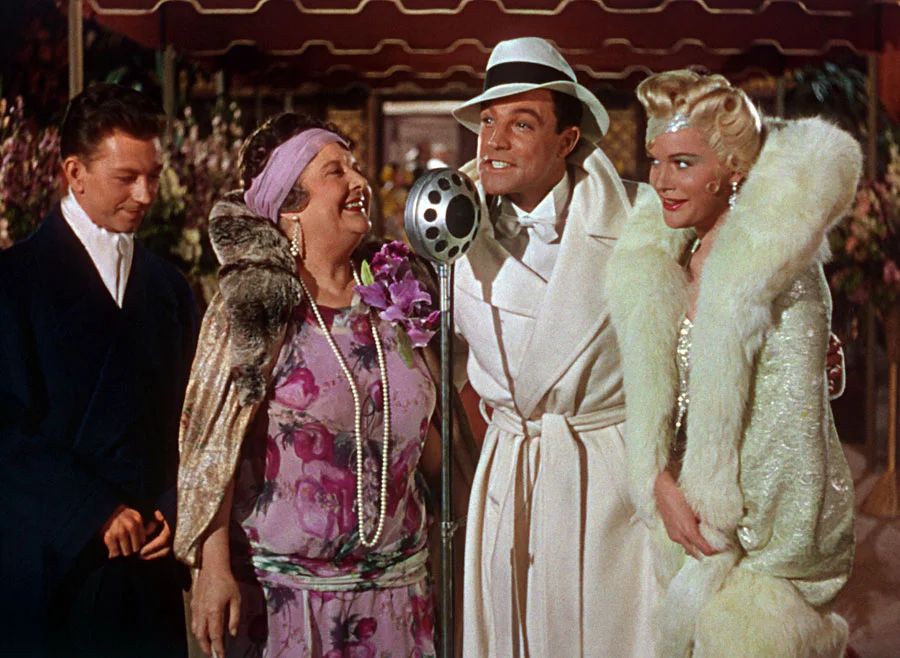Don Lockwood (Gene Kelly) and friends on the red carpet in Singin’ in the Rain .
