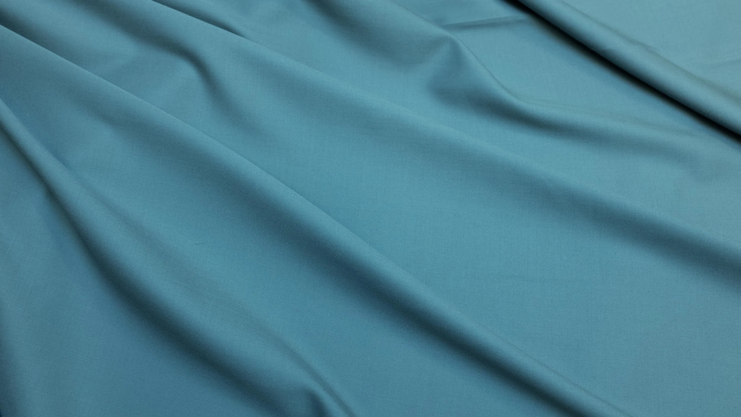 Smoke Grey Gabardine - Wool gabardine’s tight twill weave yields a rich, saturated color and a liquid hand that made it a postwar staple, when most men owned a gabardine suit or two for spring and fall, usually in navy and tan. This particularly luxurious 9 oz, 160s gabardine has a 1930s-inspired shade is difficult to describe (smoke? putty? elephant?), but it’s like no other grey you’ve ever seen, elemental and enriching.