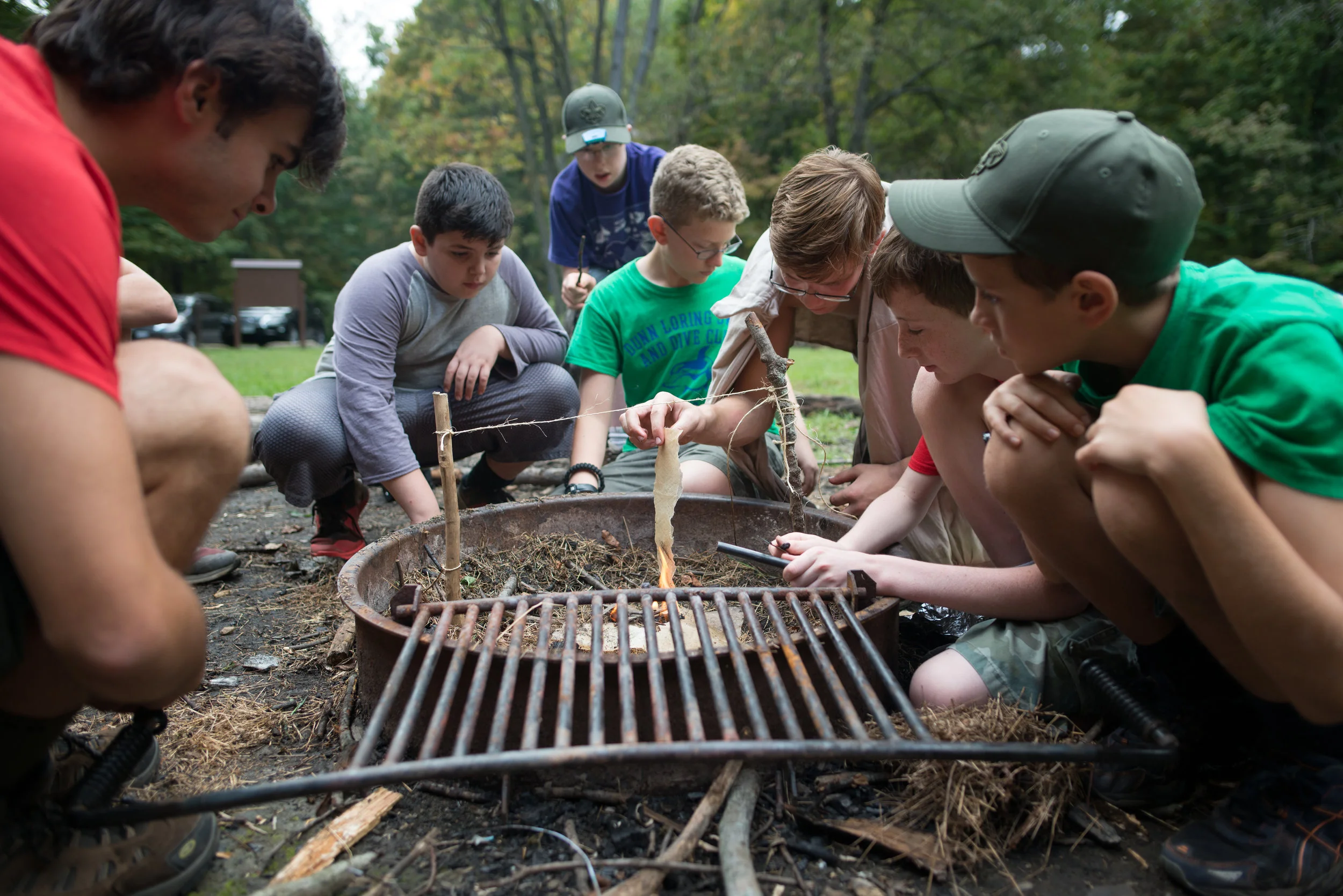 Lead by their patrol leader, Philip, first year scouts in BSA Troop 1978 scouts go head-to-head against older scouts in a fire-building competition.