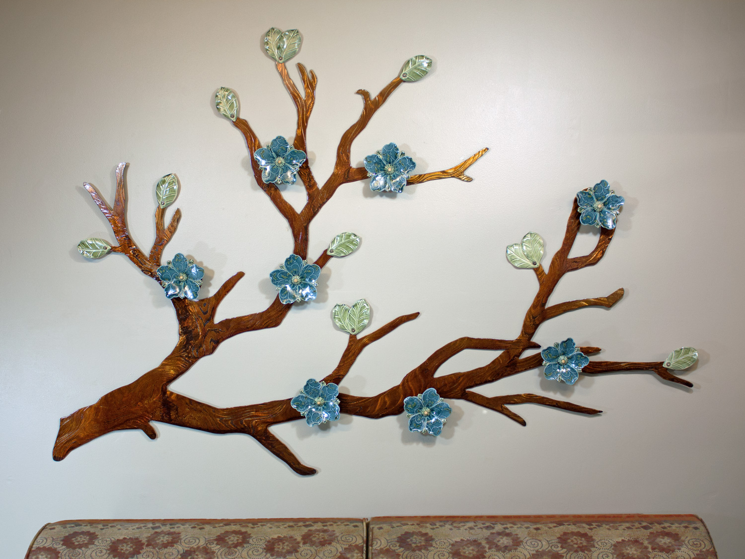 Signature flower design shown in Denim blue glaze with a Brown patinaed branch; approx. 6ft wide x 4ft tall