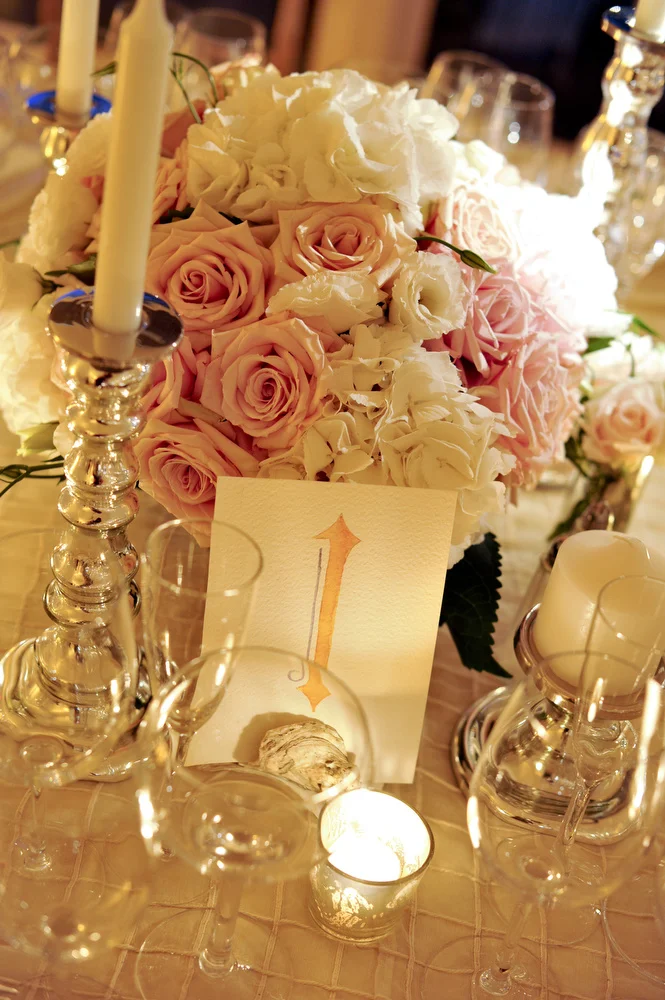 Pink and white centerpiece with candlelight