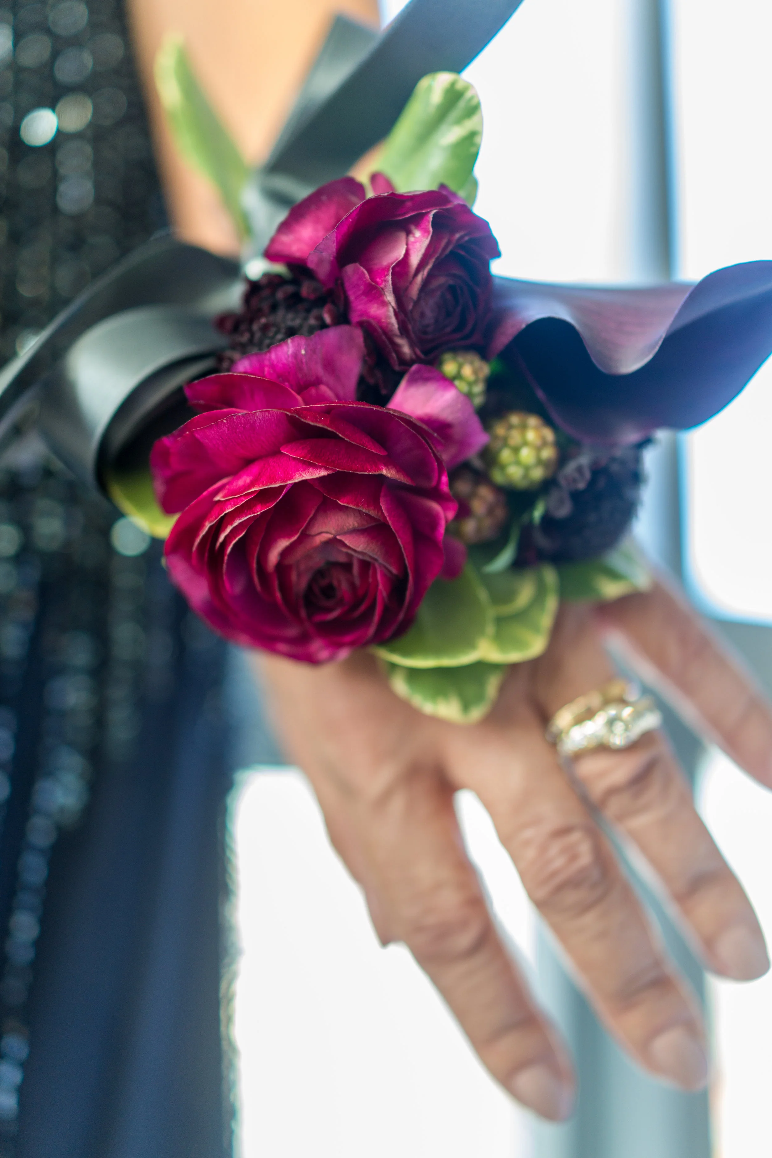 Ranunculus and black calla wrist corsage