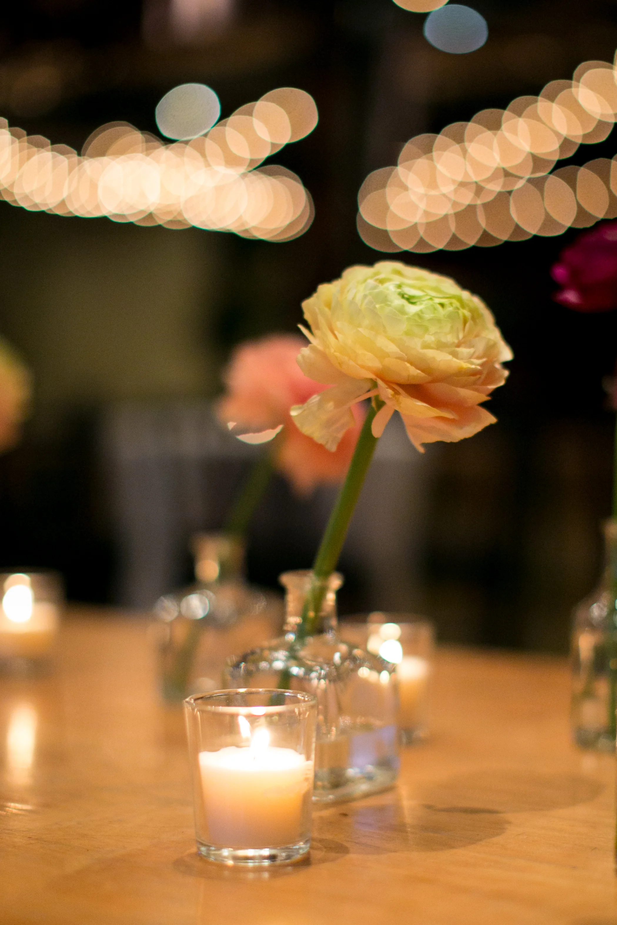 Ranunculus and candlelight