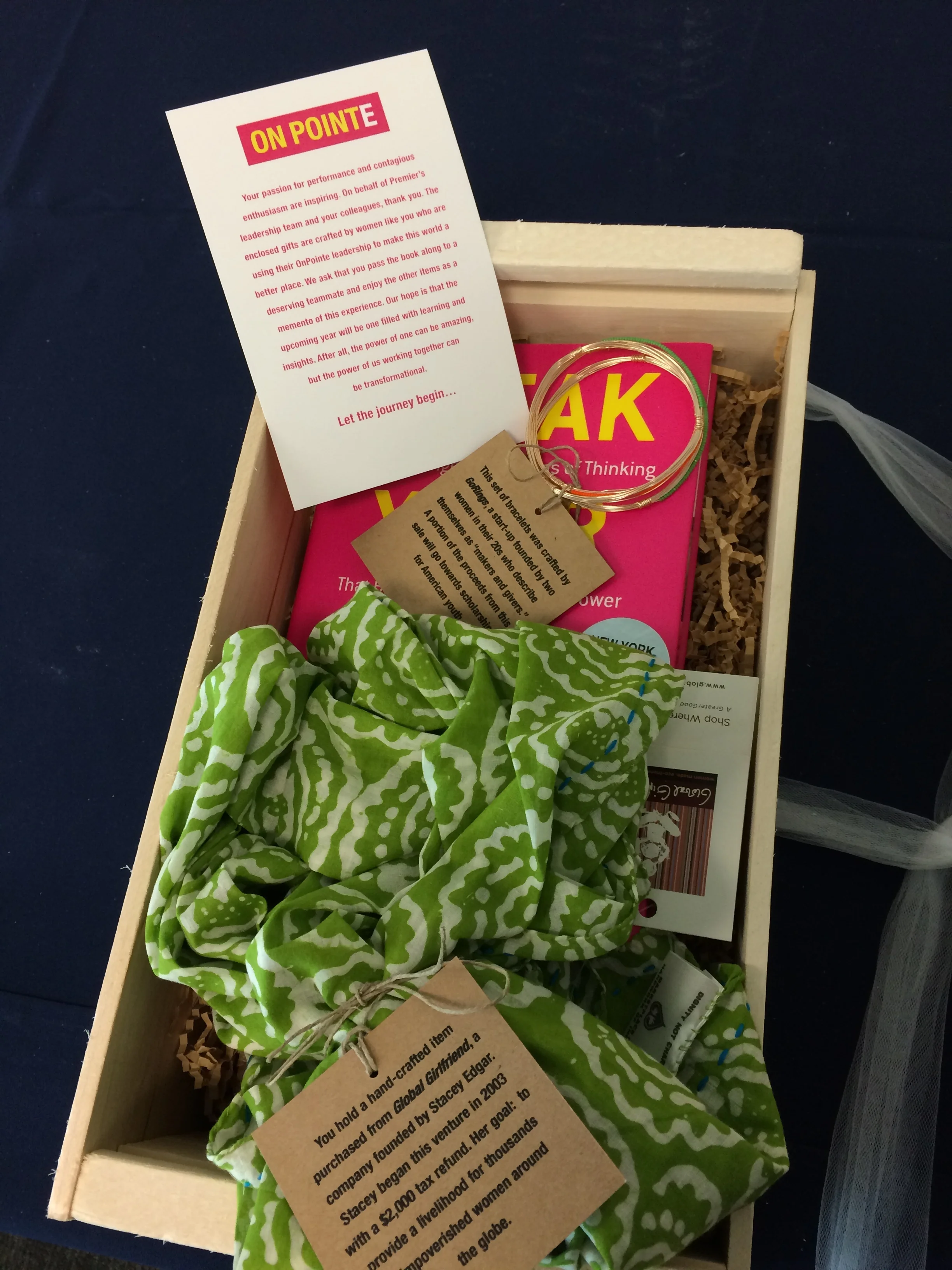  The box contained a copy of  Break Your Own Rules , authored by the seminar leaders, for the select participants to pass on to a deserving team member. &nbsp;The other gift items were handcrafted by women globally who are working to make the world a