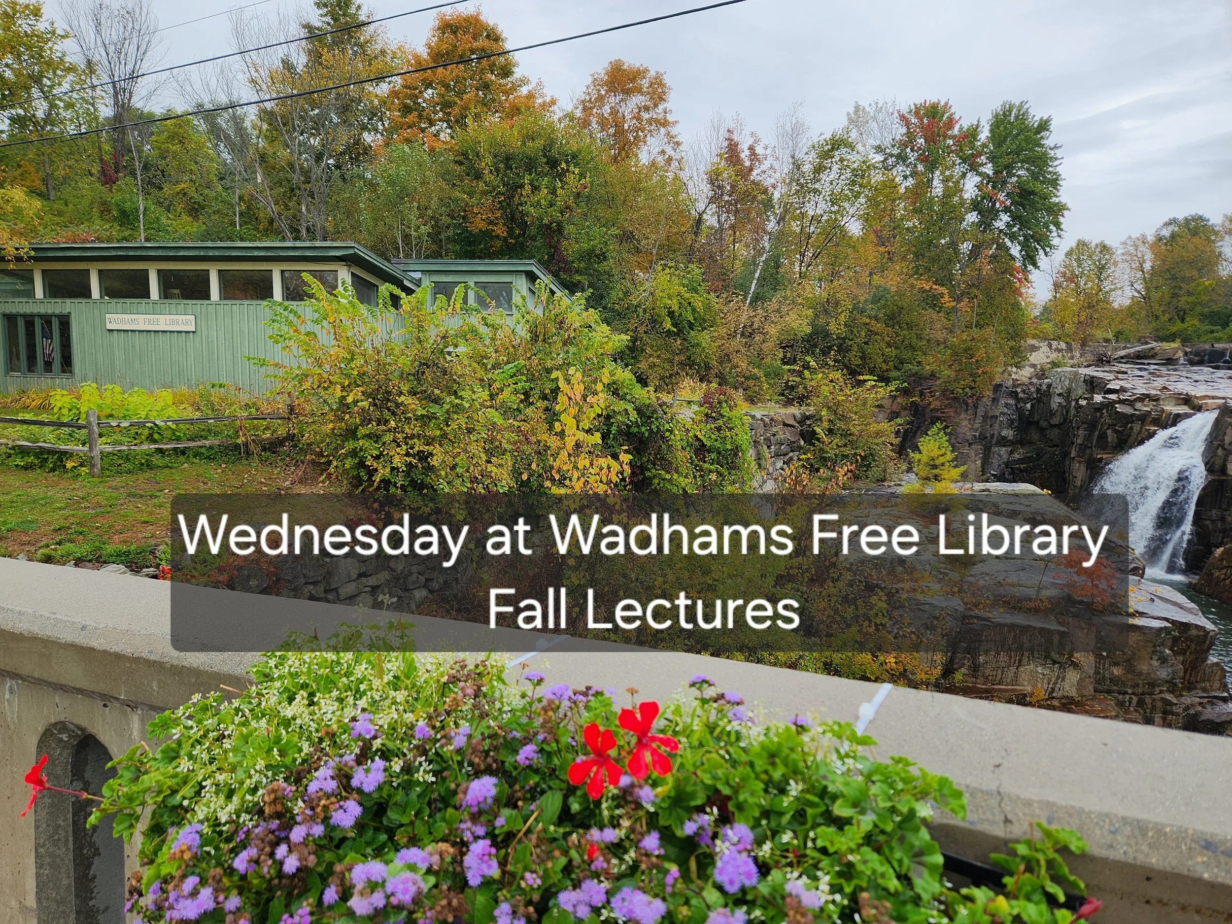 Library seen from bridge in Wadhams, flowers in fore front, waterfalls on the left library on the right back ground, Wednesdy at wadhams free library fall lectures in a shaded background