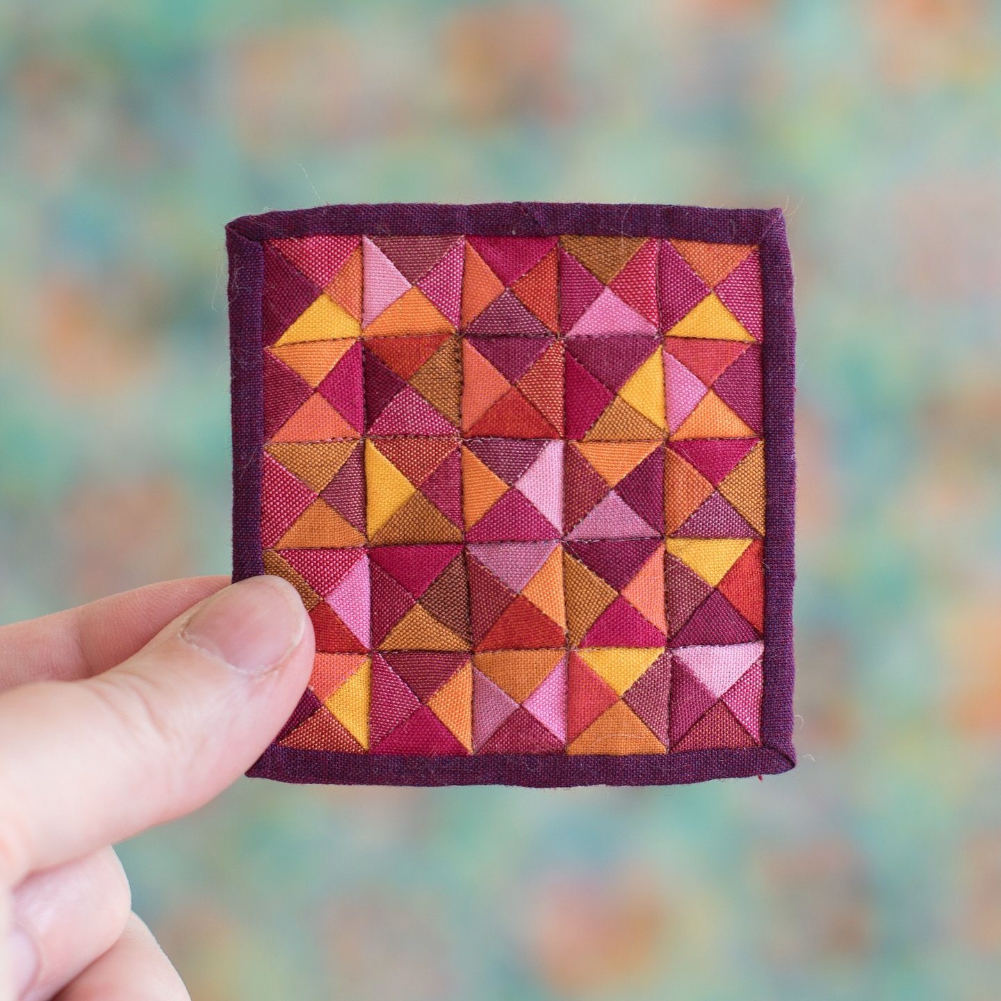 The color plan for this quilt came from a photo of a pink and orange shag rug in one of my vintage women&rsquo;s magazines from the 1960s.
2 3/4&rdquo; square. 100 pieces. 

These pieces are small but are not &ldquo;quick and easy.&rdquo;

Pieced wit