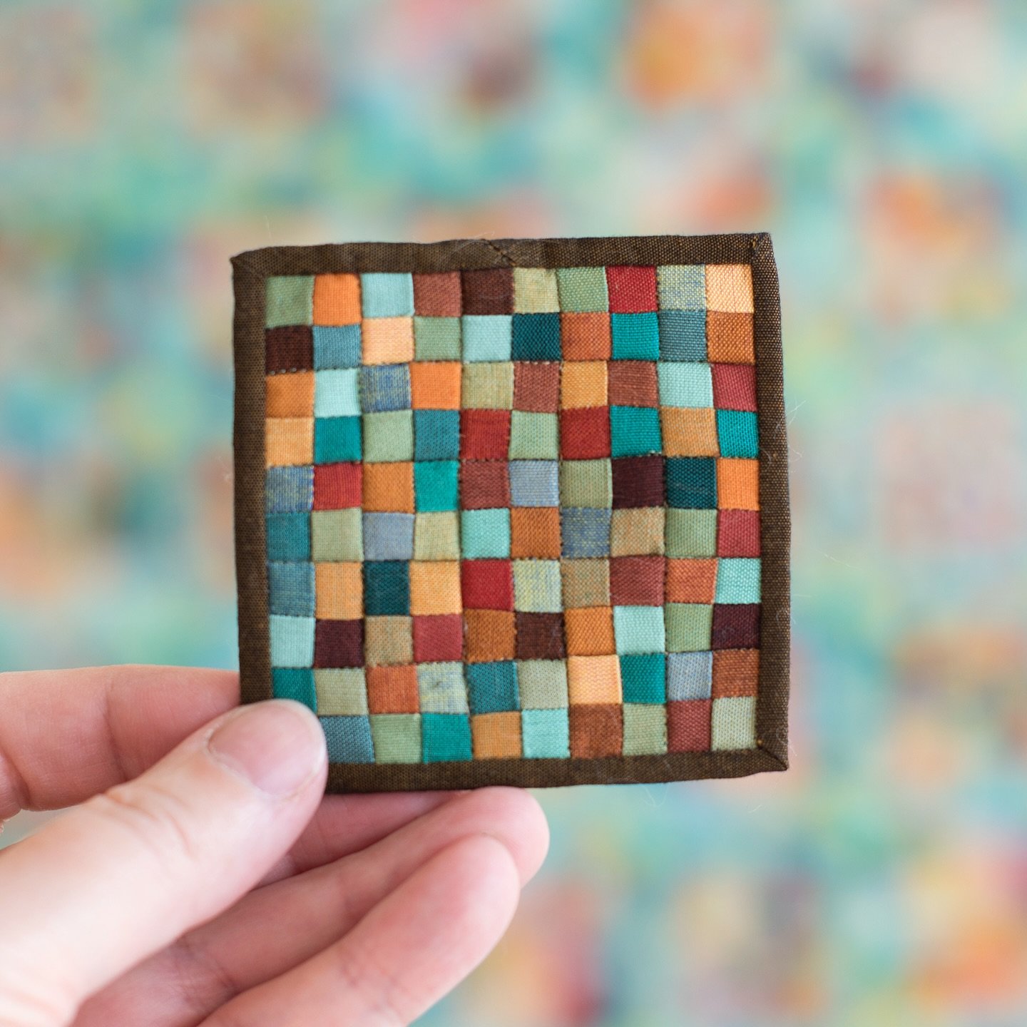 Earthtone squares. 2 7/8&rdquo; square.
Sewn with 80wt DecoBob. quilted with 100wt Invisafil by @wonderfilspecialtythread 

##sewsmall #sewtherainbow #ridiculouslytinyquilts #miniaturequilt #fiberart #textileart #sewtiny