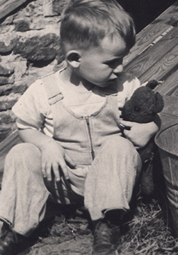 Teddy, in my arms as a child in Webster.