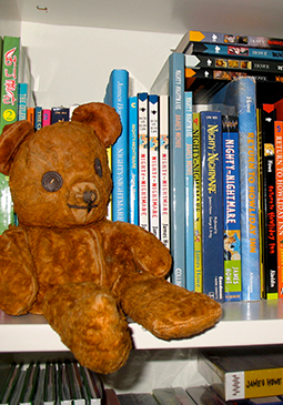 Many years later, Teddy is still with me. Here he is on a bookshelf in my office, where I see him every day.