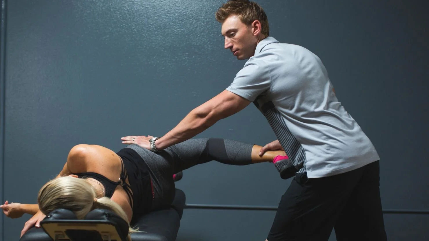 220301133209-04-stretching-personal-trainer-stock.jpg
