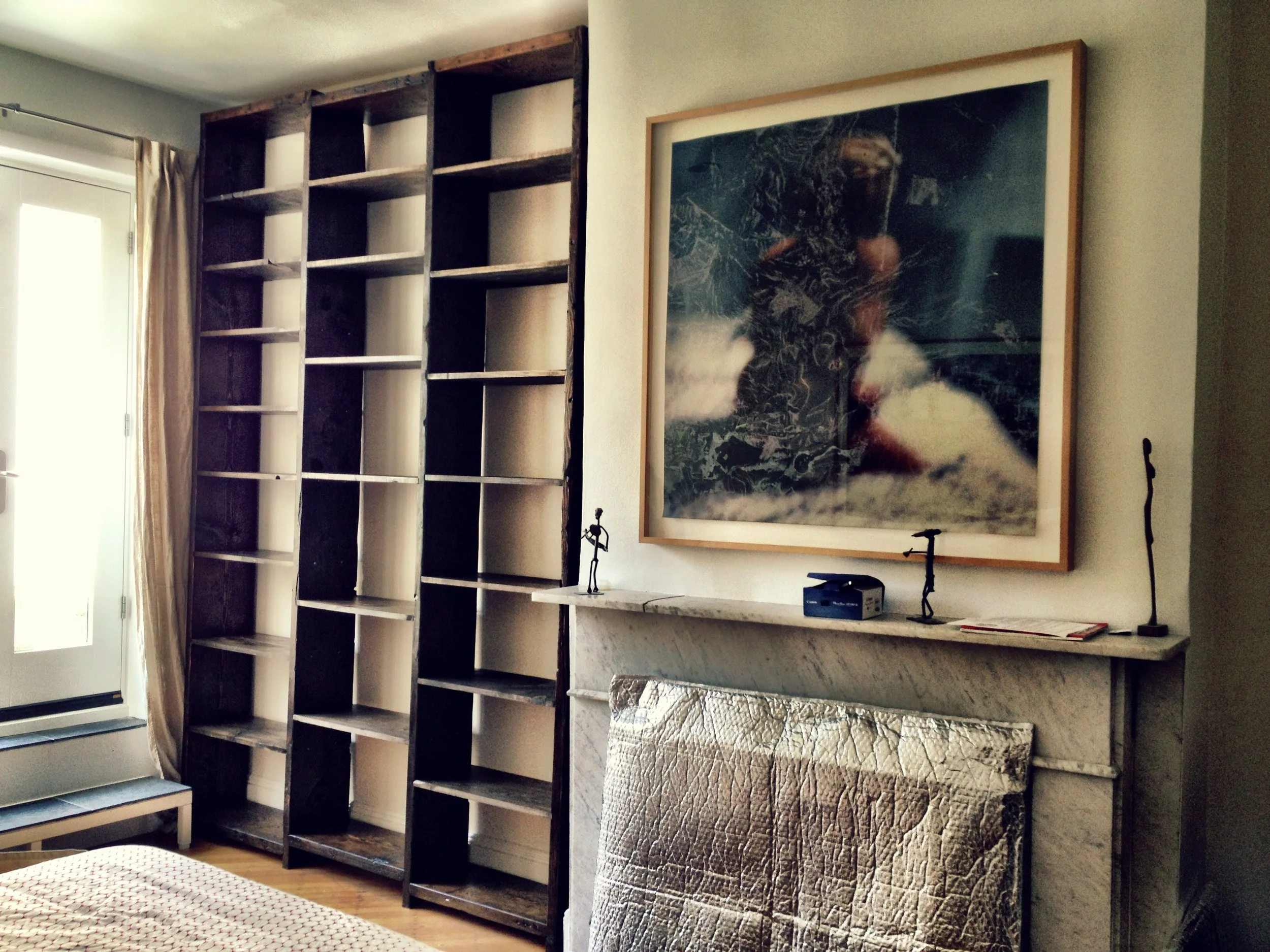 ceiling to floor reclaimed shelves