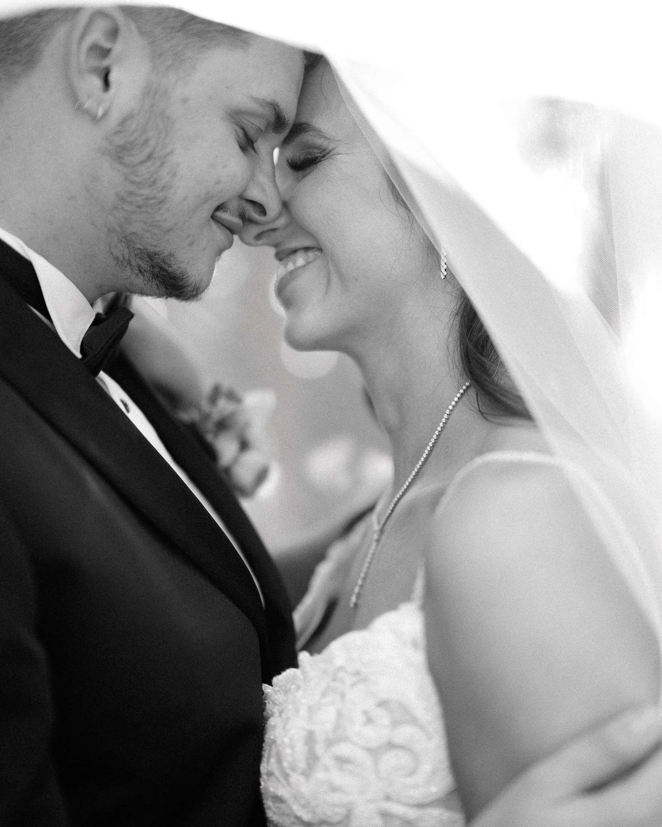 newlyweds-almost-kiss-veil-black-white-felicity-church-new-orleans.jpg