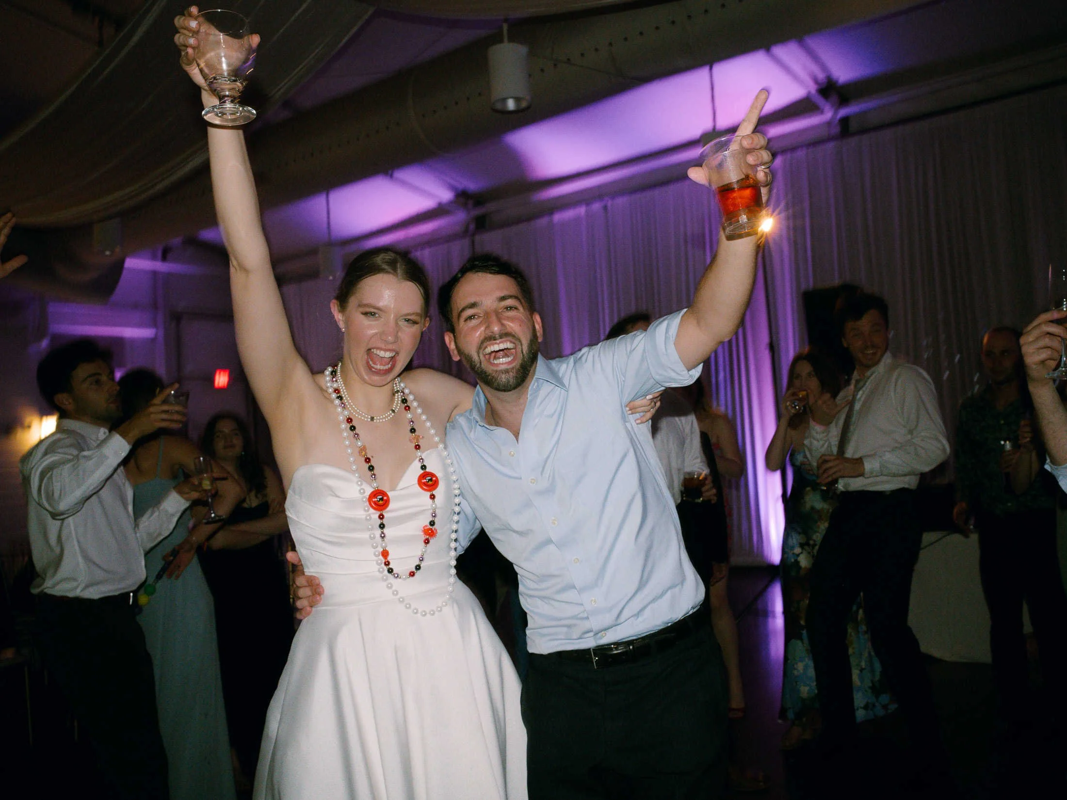 bride-groom-celebrating-arbor-room-reception-new-orleans-wedding.jpg