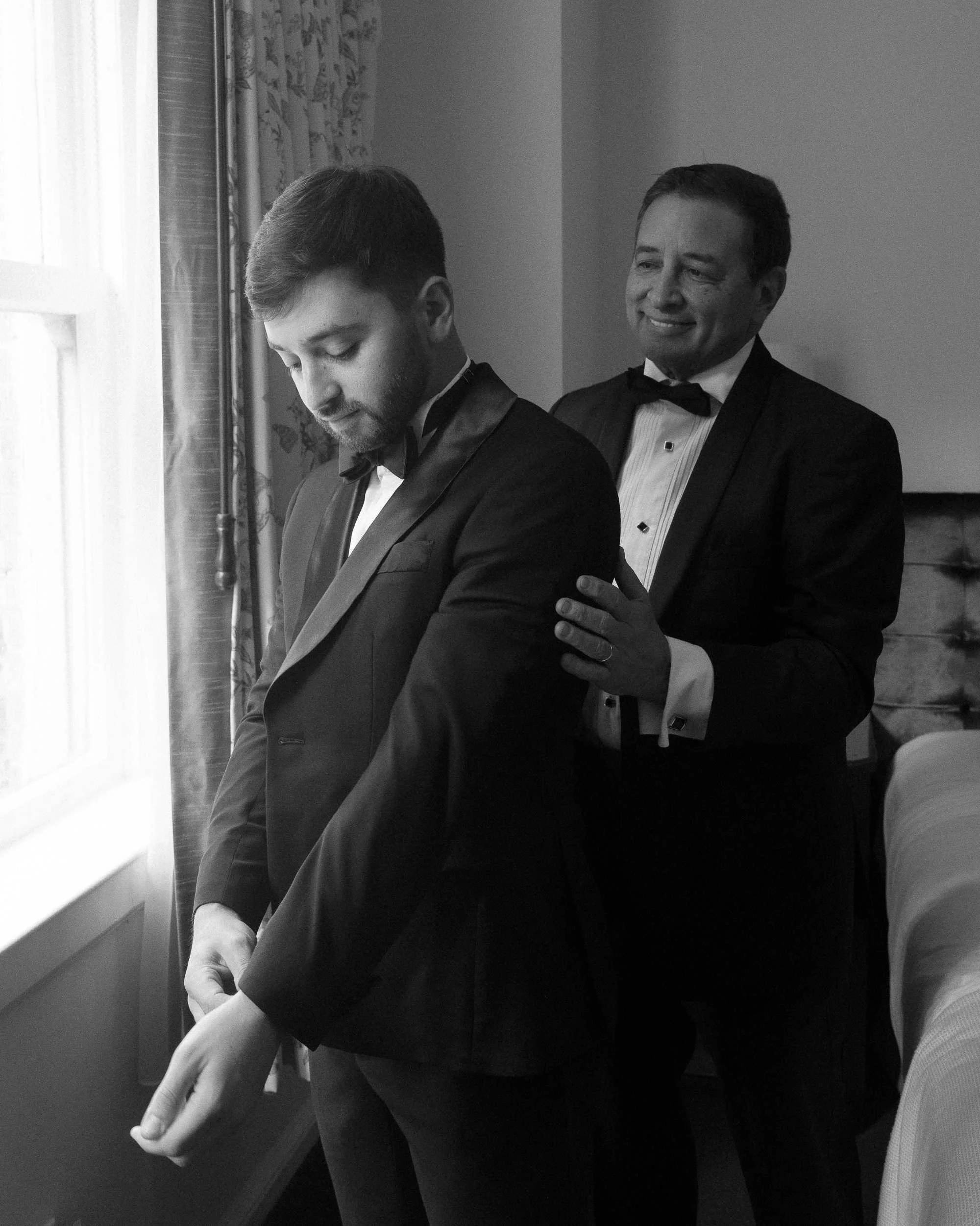 groom and his father wedding prep