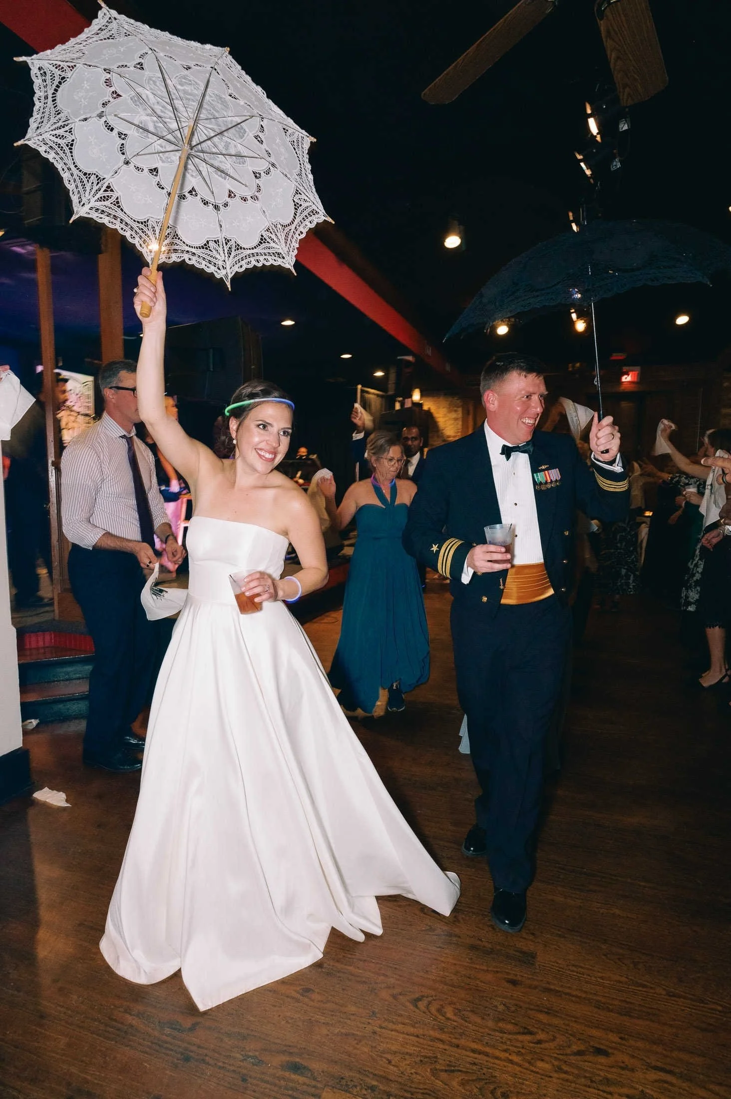 couple-second-line-parasols-rosys-jazz-hall-new-orleans-wedding.jpg