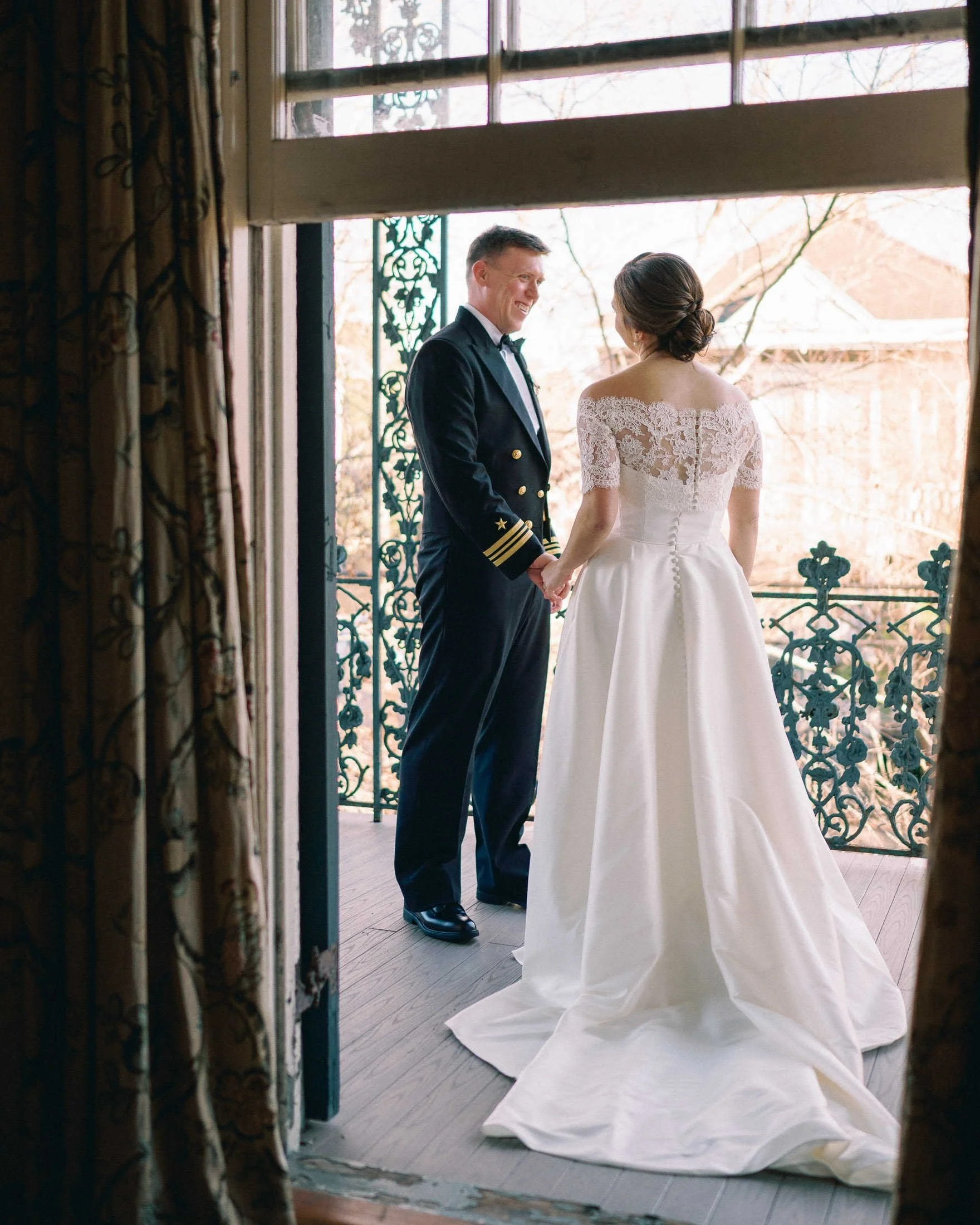 couple-holding-hands-terrell-house-balcony-new-orleans.jpg