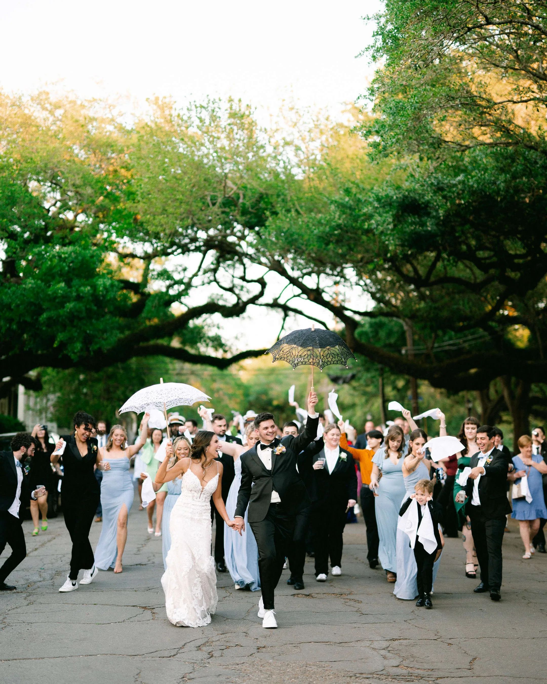 second-line-parade-lower-garden-district-new-orleans-kinfolk-brass-band-wedding.jpg