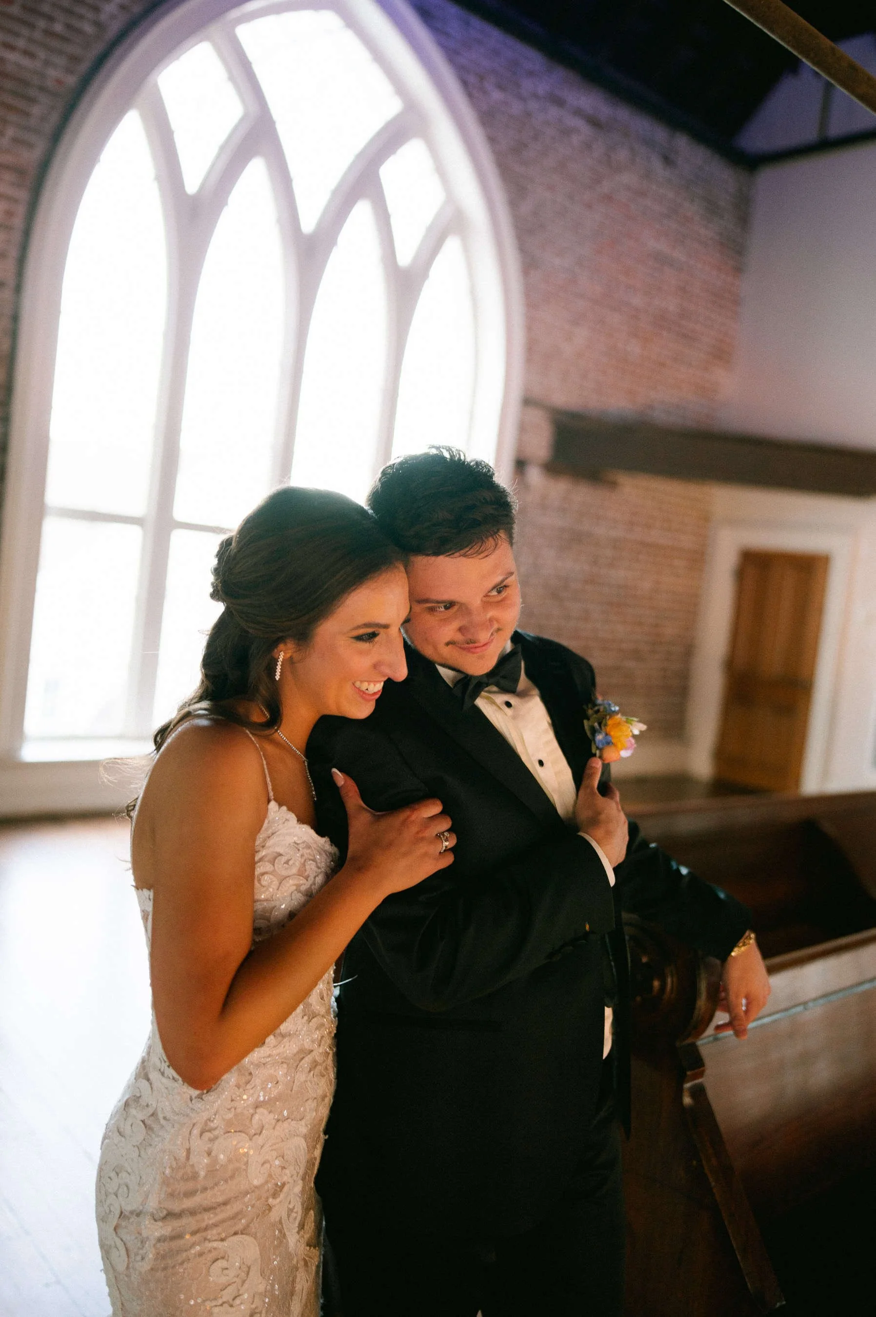 newlyweds-intimate-portrait-arched-windows-felicity-church-new-orleans.jpg