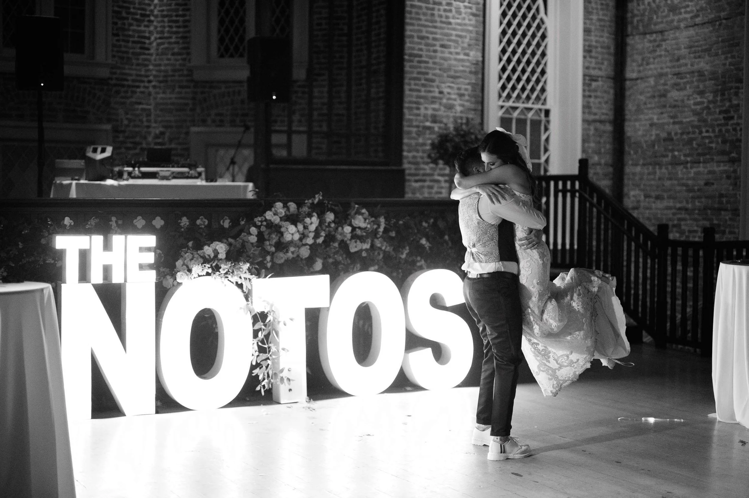 couple-embrace-the-notos-marquee-felicity-church-new-orleans-reception.jpg