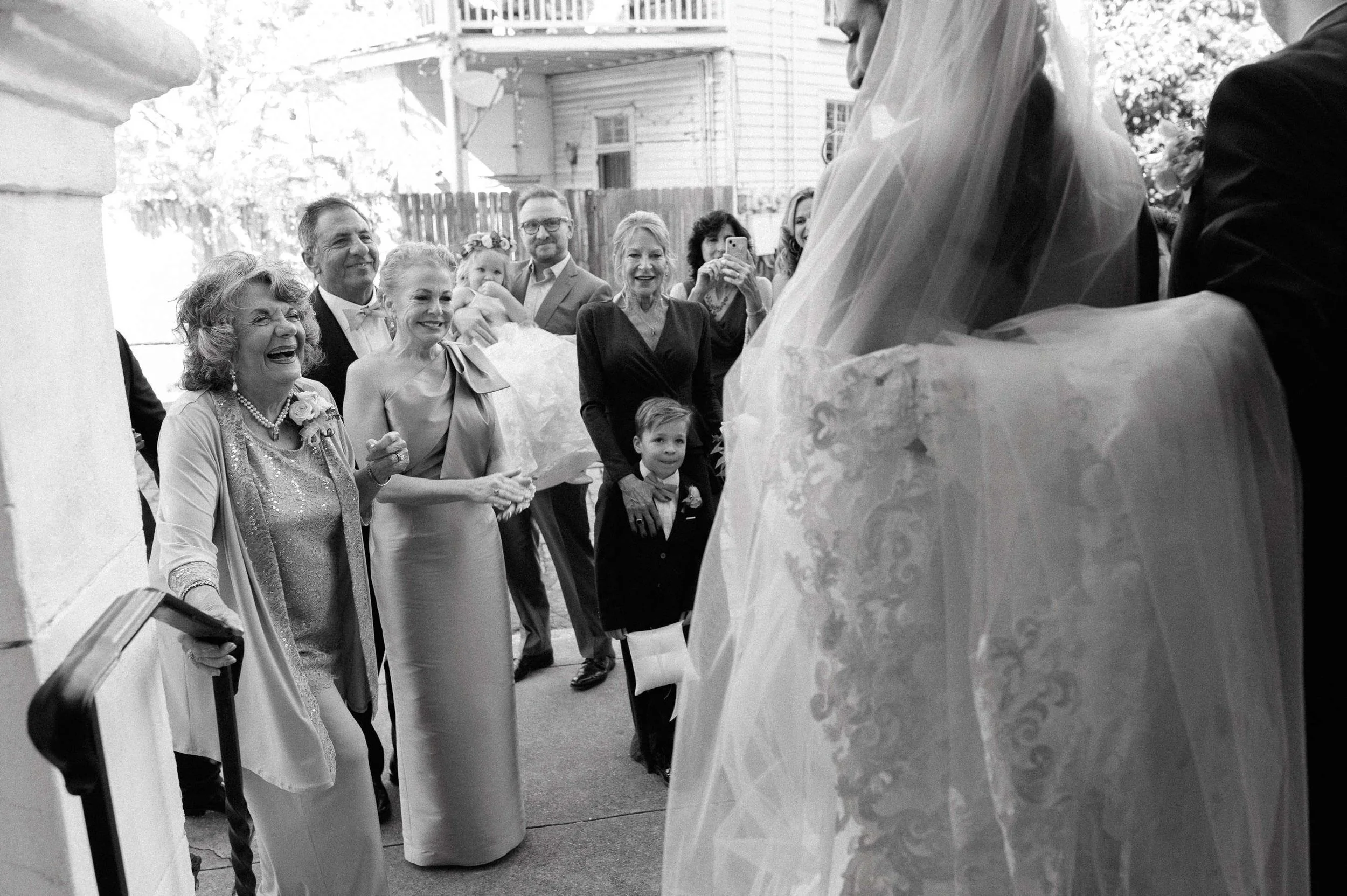 family-greeting-newlyweds-felicity-church-steps-new-orleans-documentary.jpg