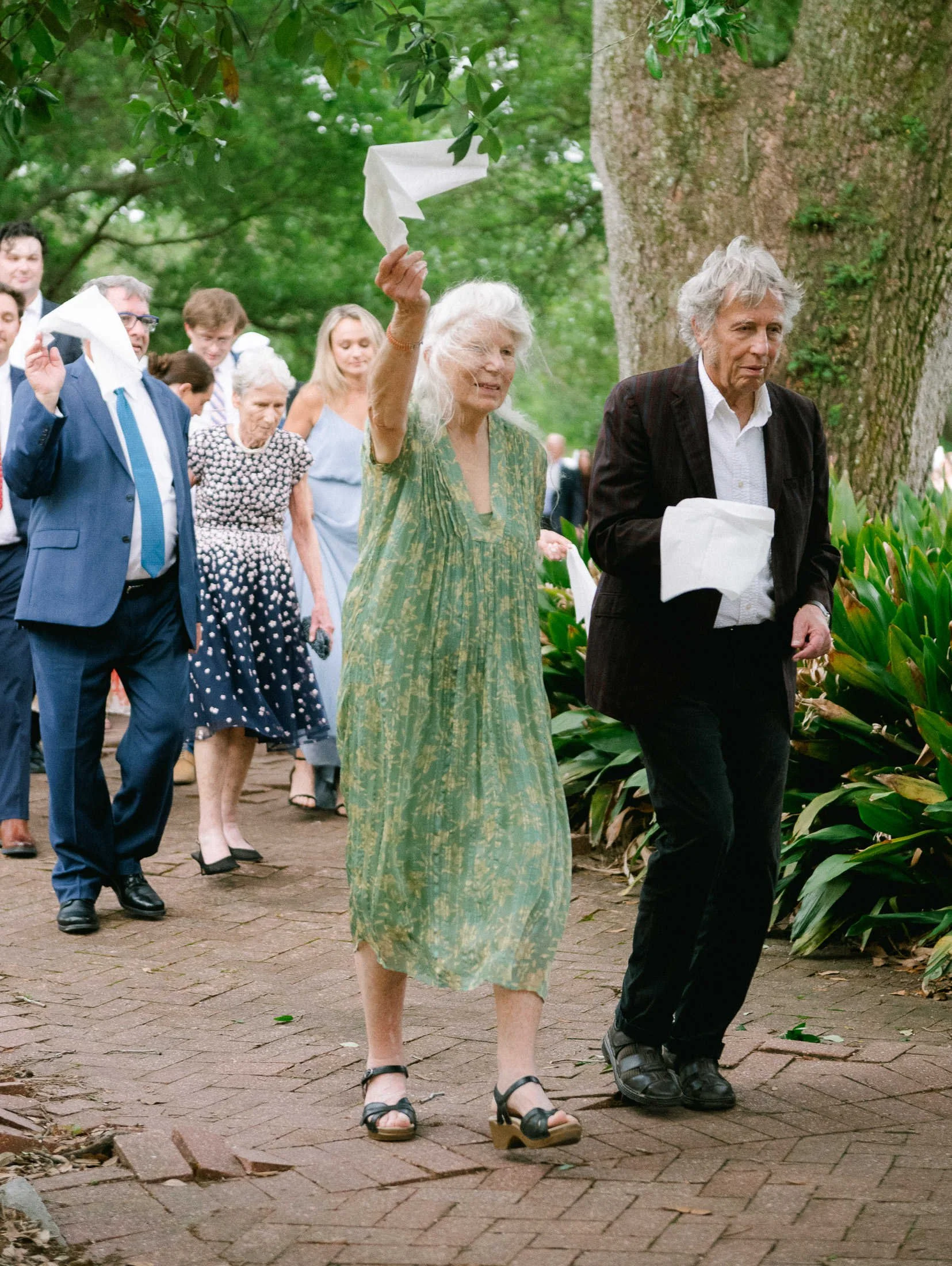 second-line-parade-guest-parasol-city-park-new-orleans-wedding.jpg