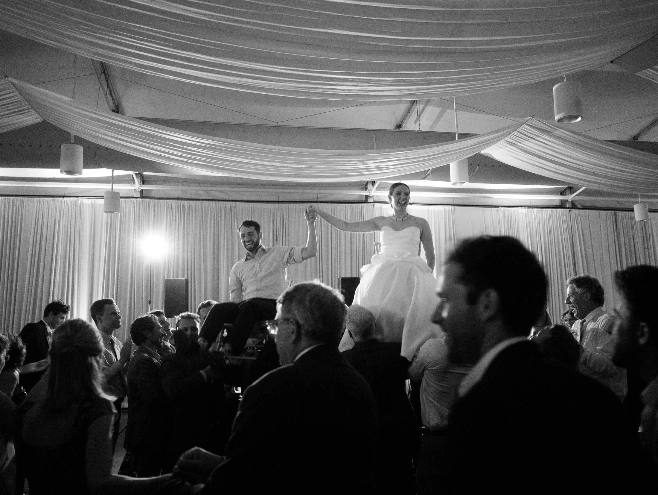 hora-chair-lifting-arbor-room-new-orleans-wedding-film-photography.jpg