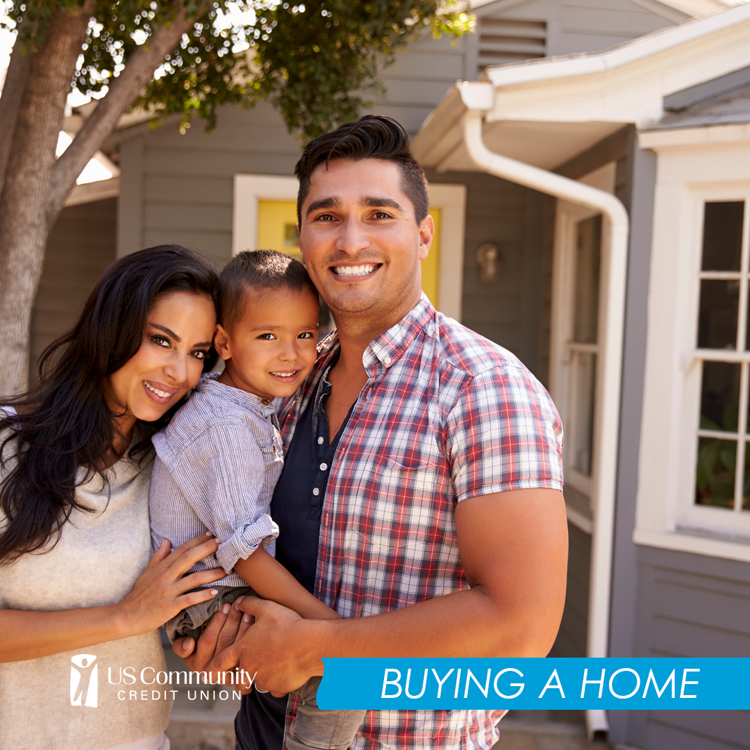 a happy family in front of their home