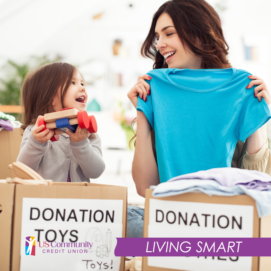 A mother change child adding toys and clothes to a donation box