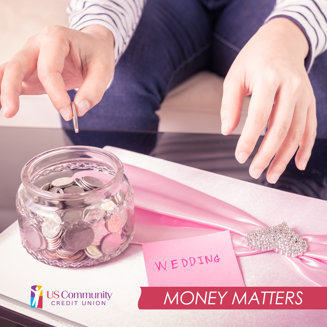 Hand putting a coin in a coin jar with a sticky note next to it that says wedding.