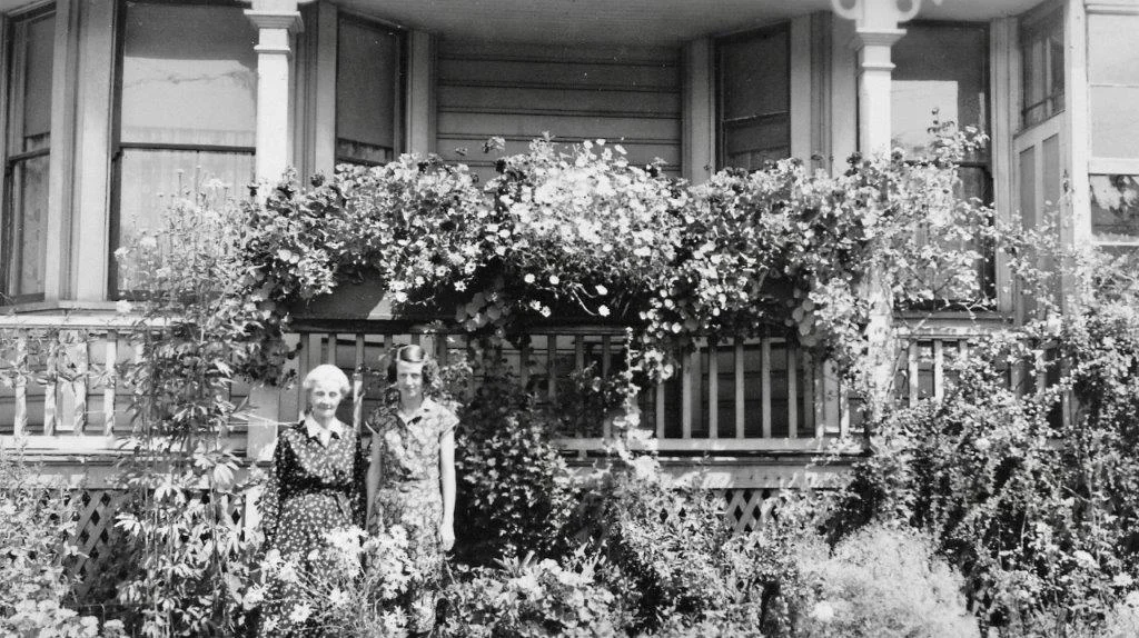 642 Battery Street - Caroline and Carrie Nairne in front of the house and their beautiful garden. probably C.1928 when Carrie would have been 25.