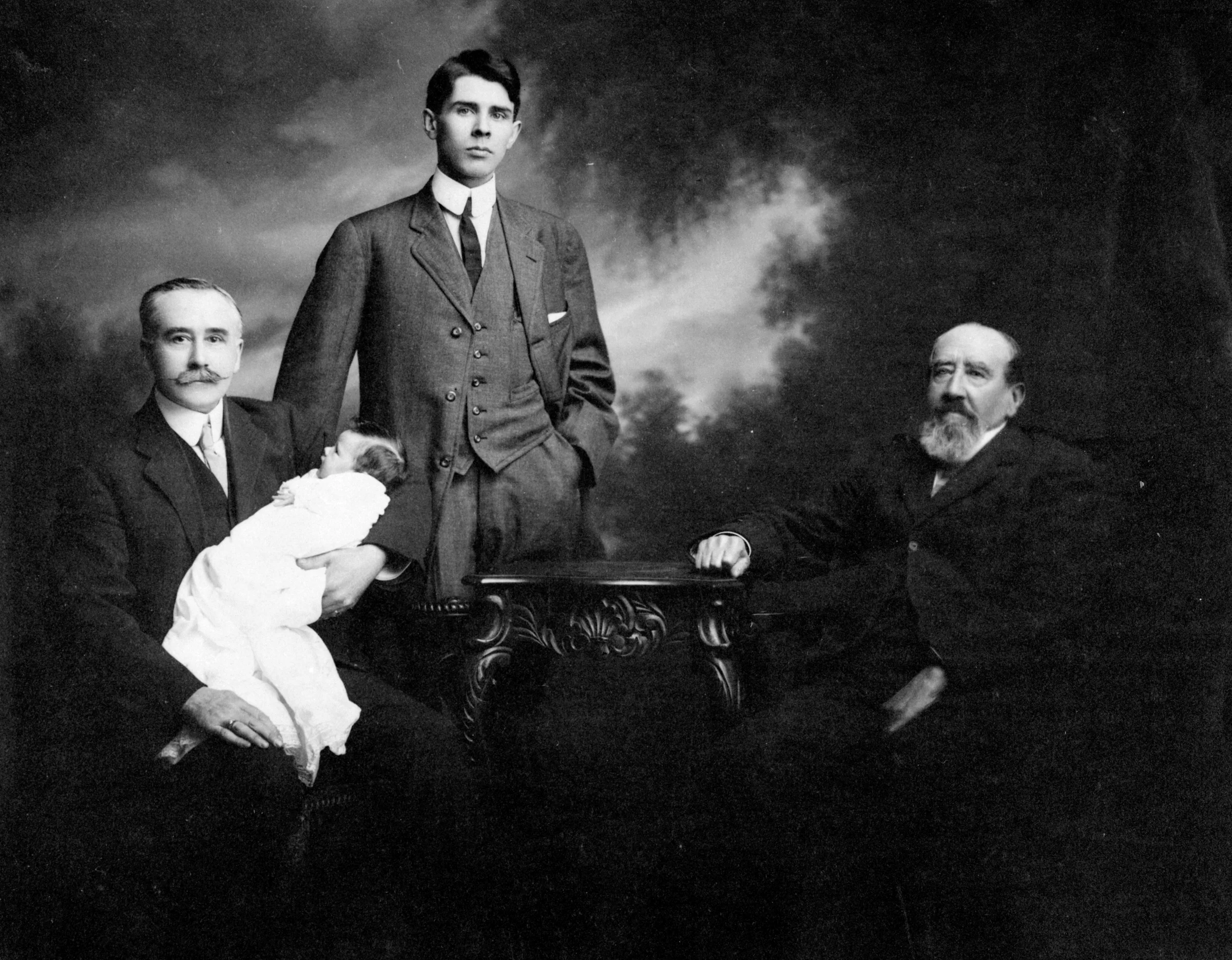 Four generations of the Kent family: Herbert holding his granddaughter Marion; son Daryl and father Charles. 28 March 1913. Image F-02018_141 courtesy of the Royal BC Museum Archives.